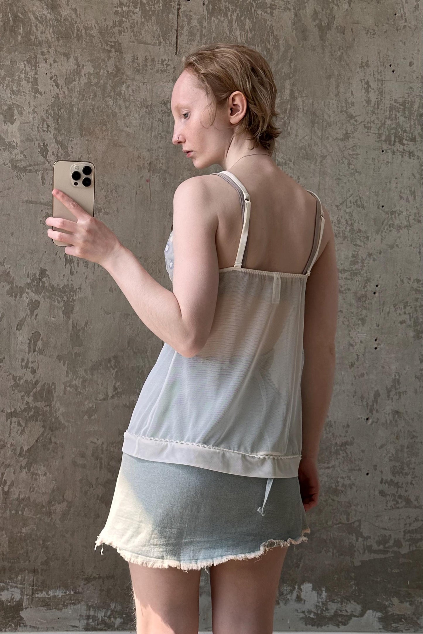 a woman taking a selfie with her cell phone