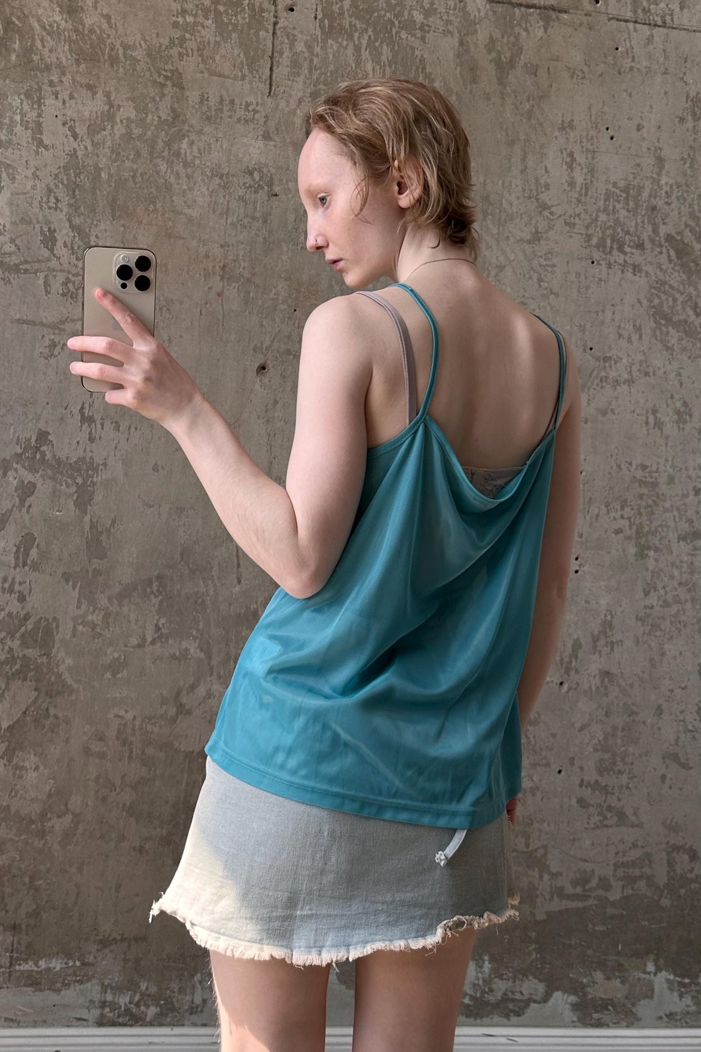 a woman taking a picture with her cell phone