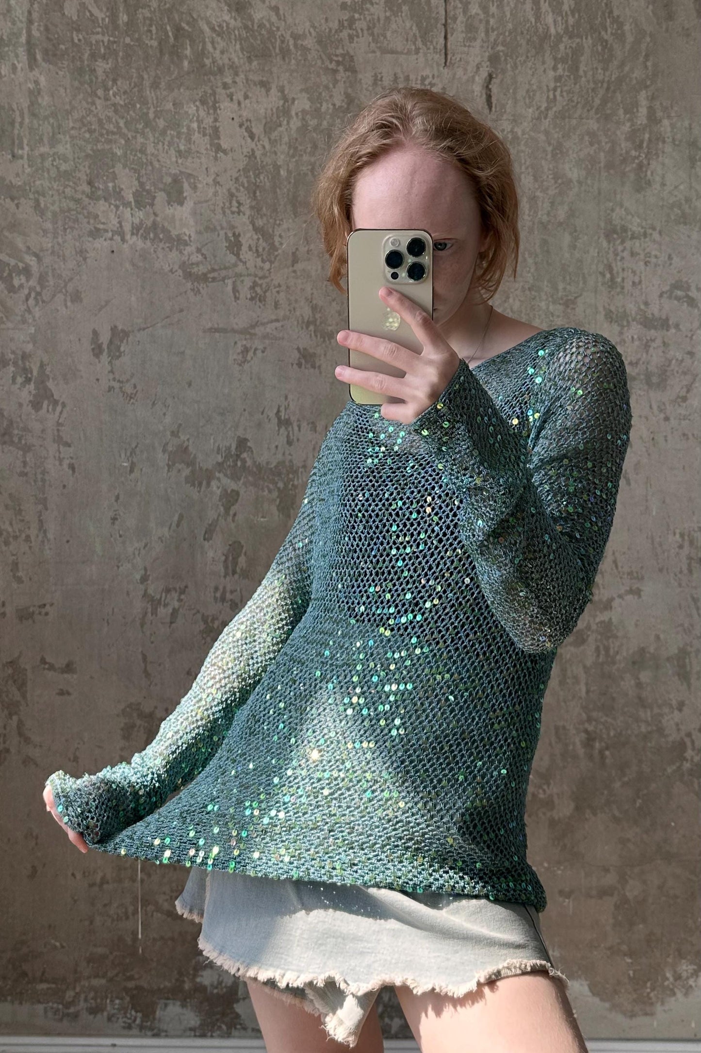a woman taking a selfie with her cell phone
