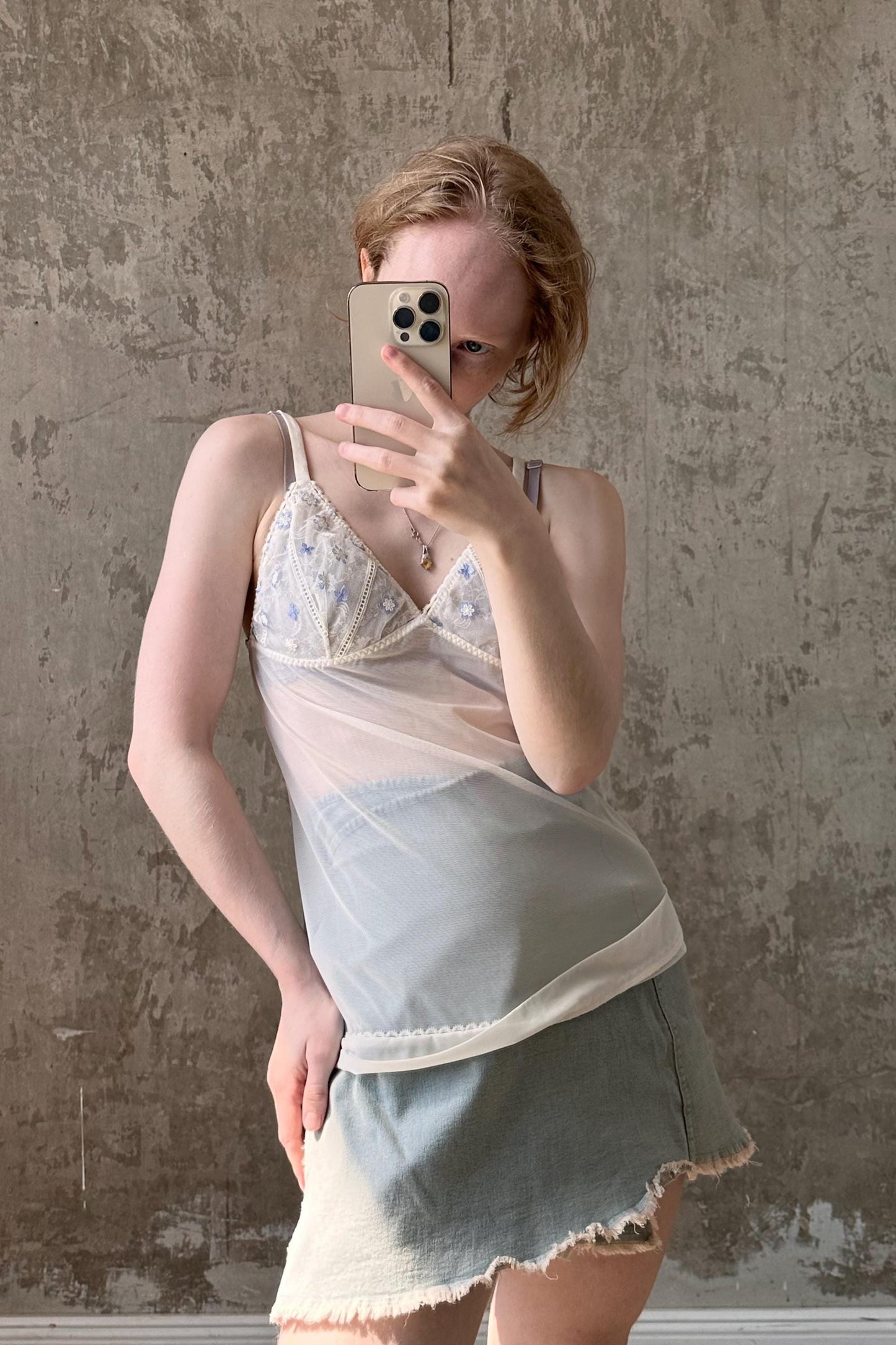 a woman taking a selfie with her cell phone