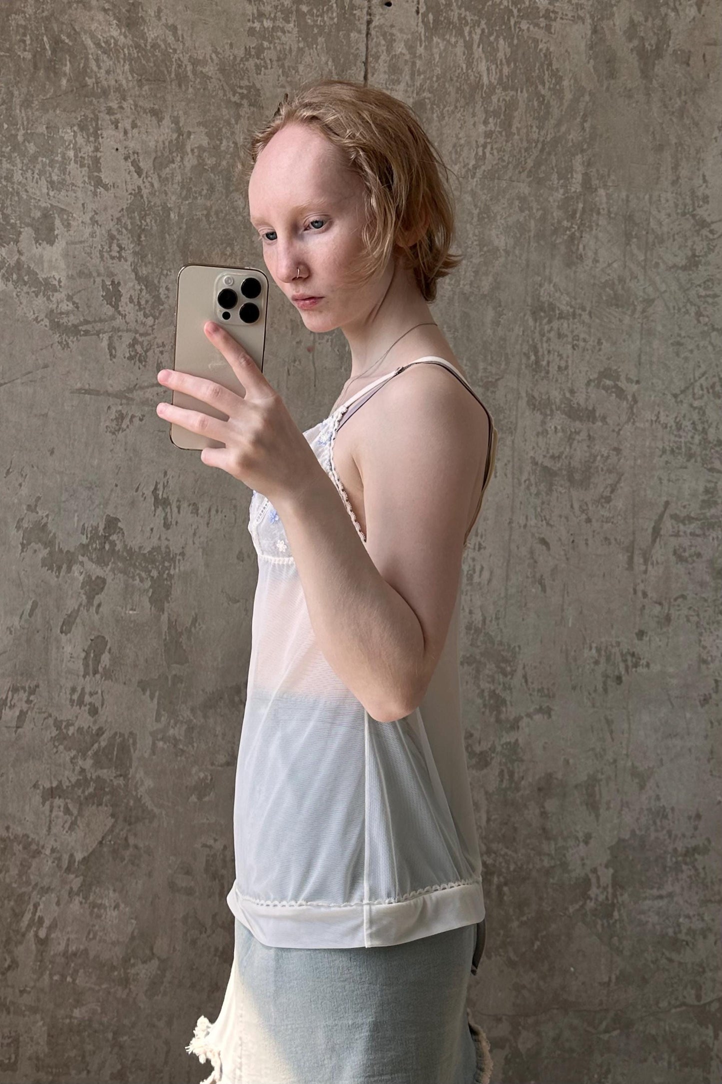 a woman holding a cell phone up to her face