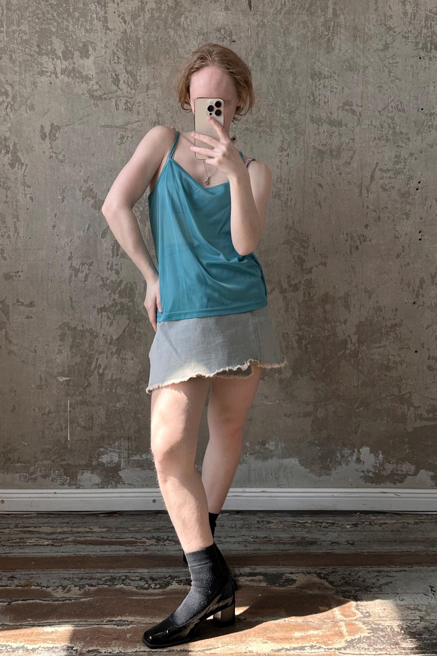 a woman taking a selfie with her cell phone