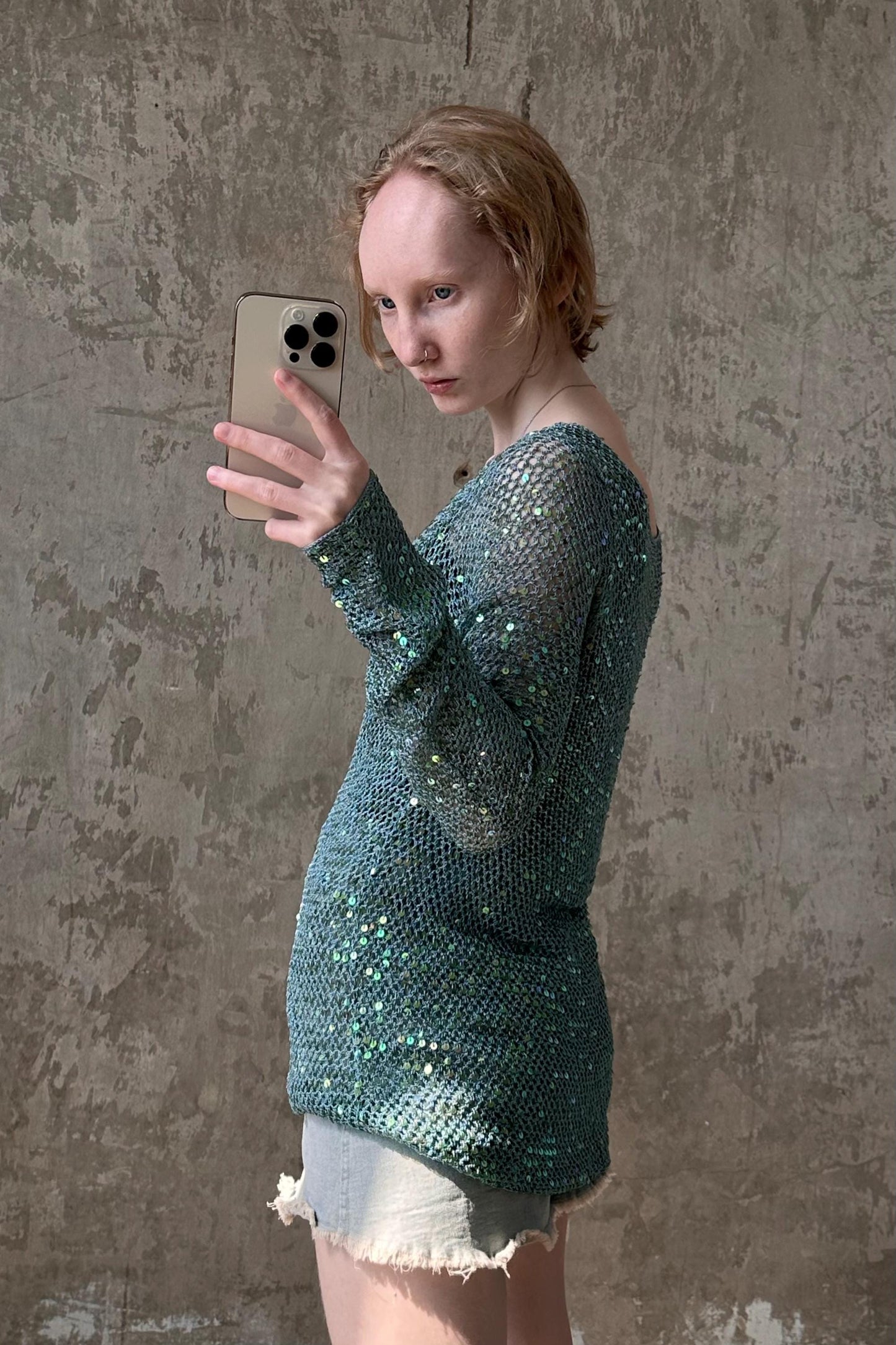 a woman is taking a selfie with her cell phone