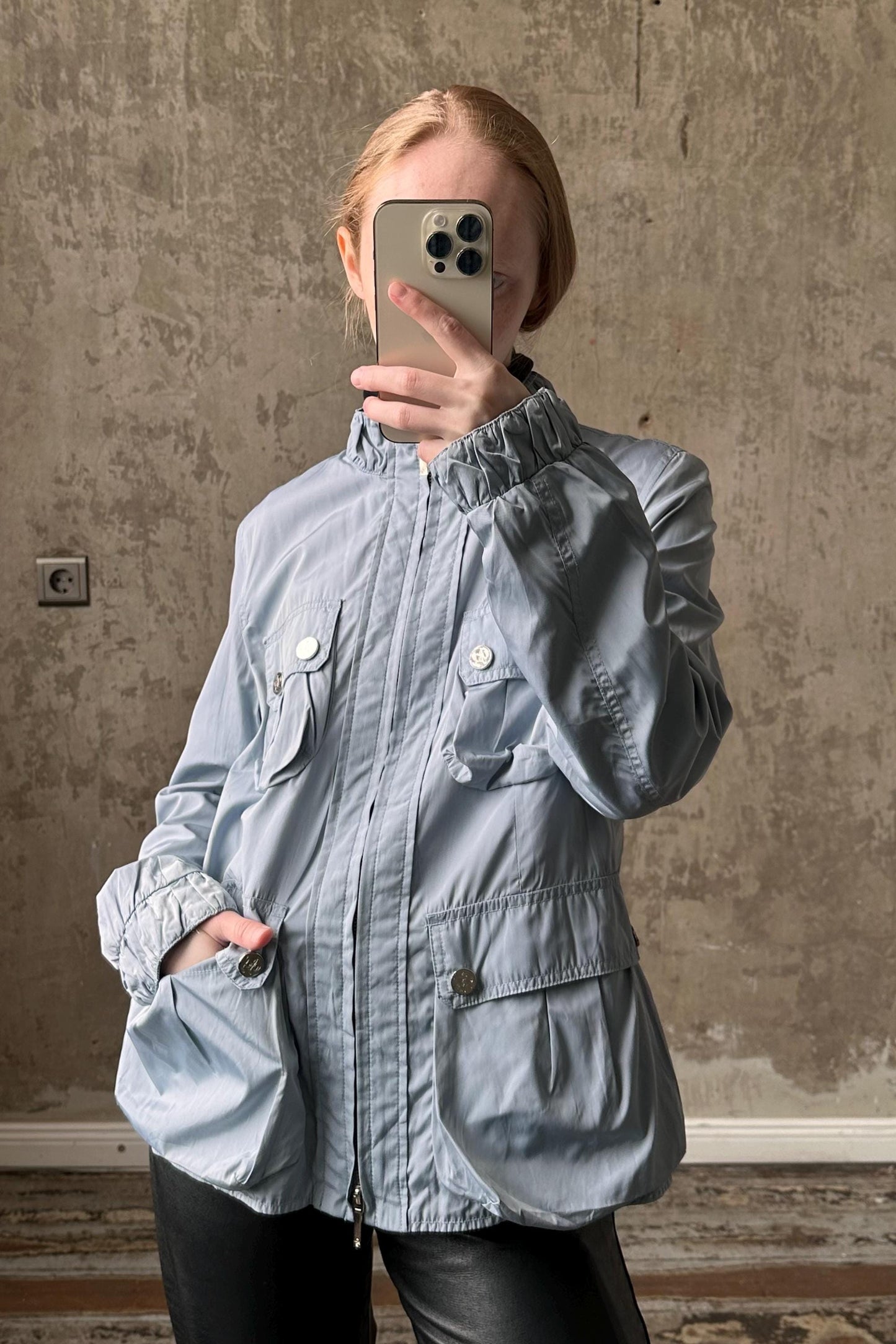 a woman taking a selfie with her cell phone