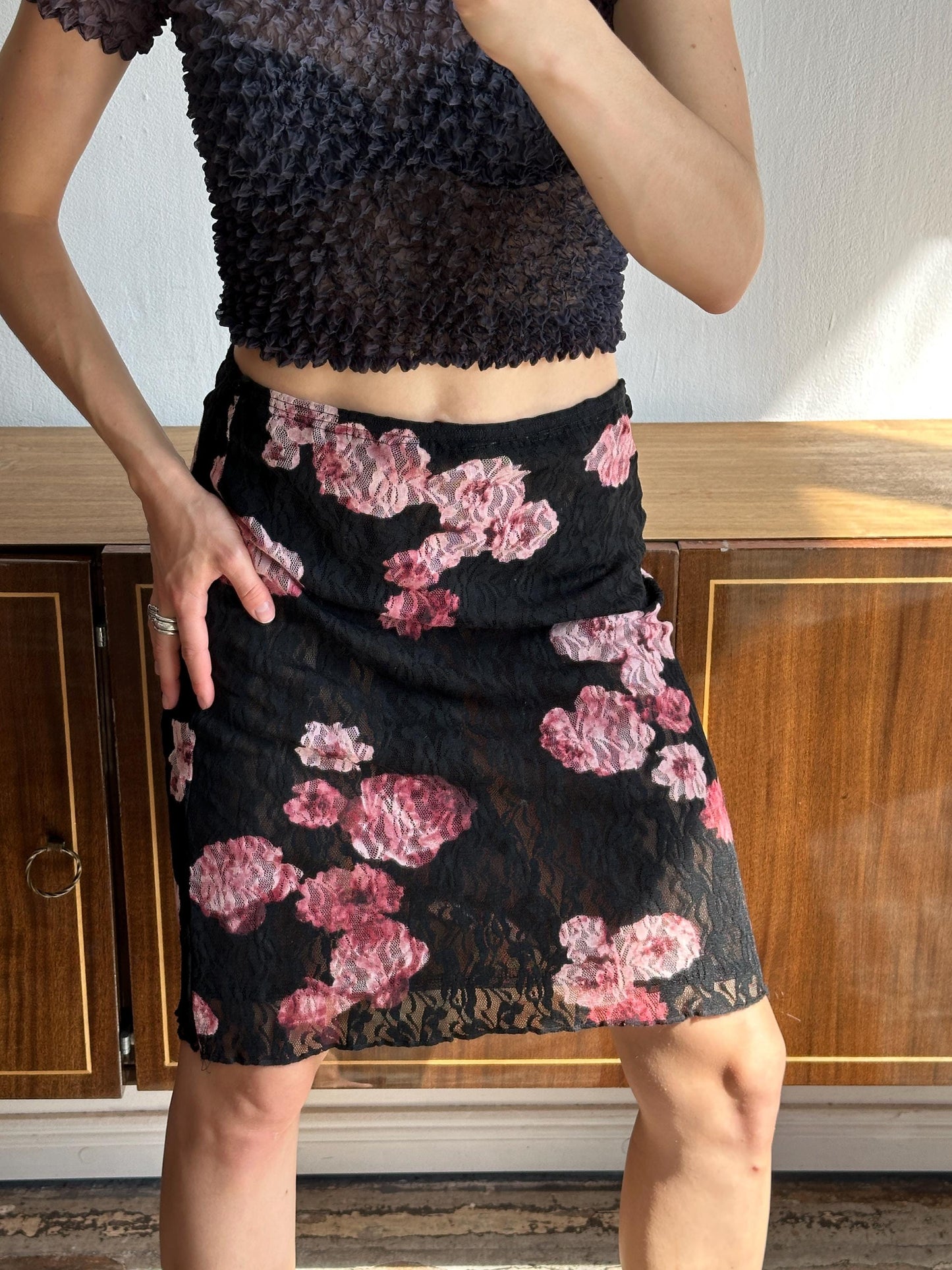 Vintage mini lace skirt with floral motif in black