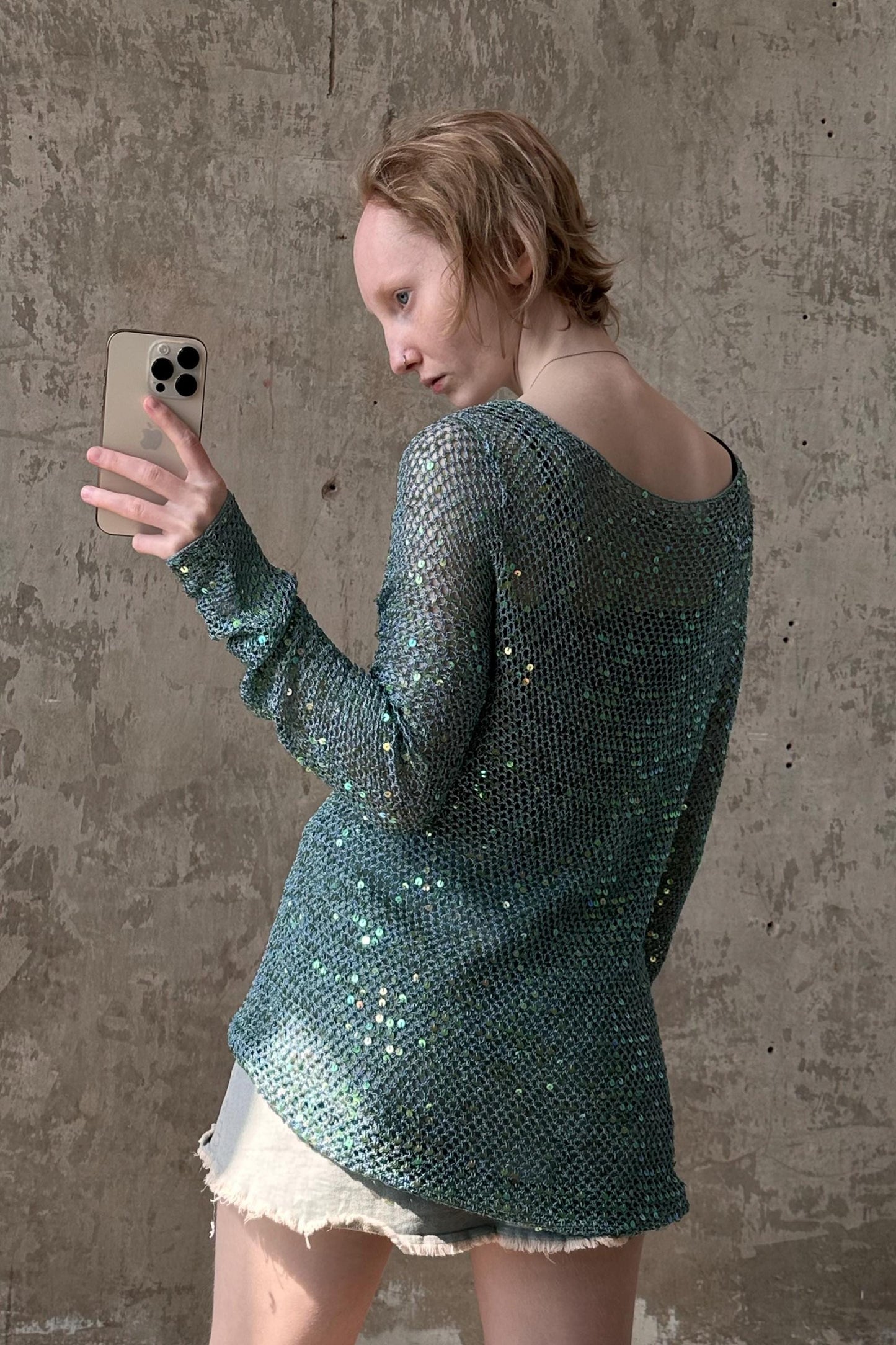 a woman taking a selfie with her cell phone