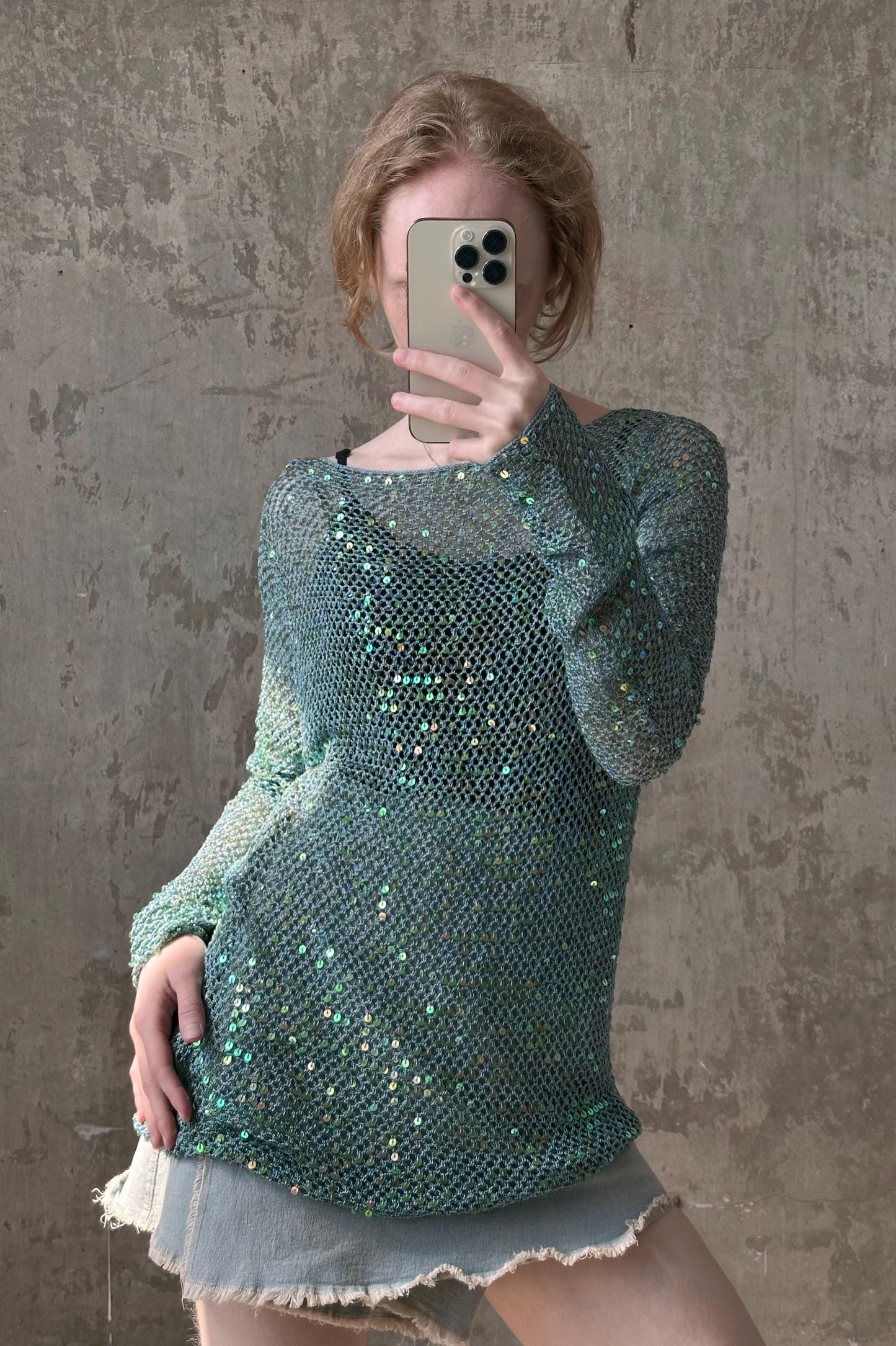 a woman taking a selfie with her cell phone