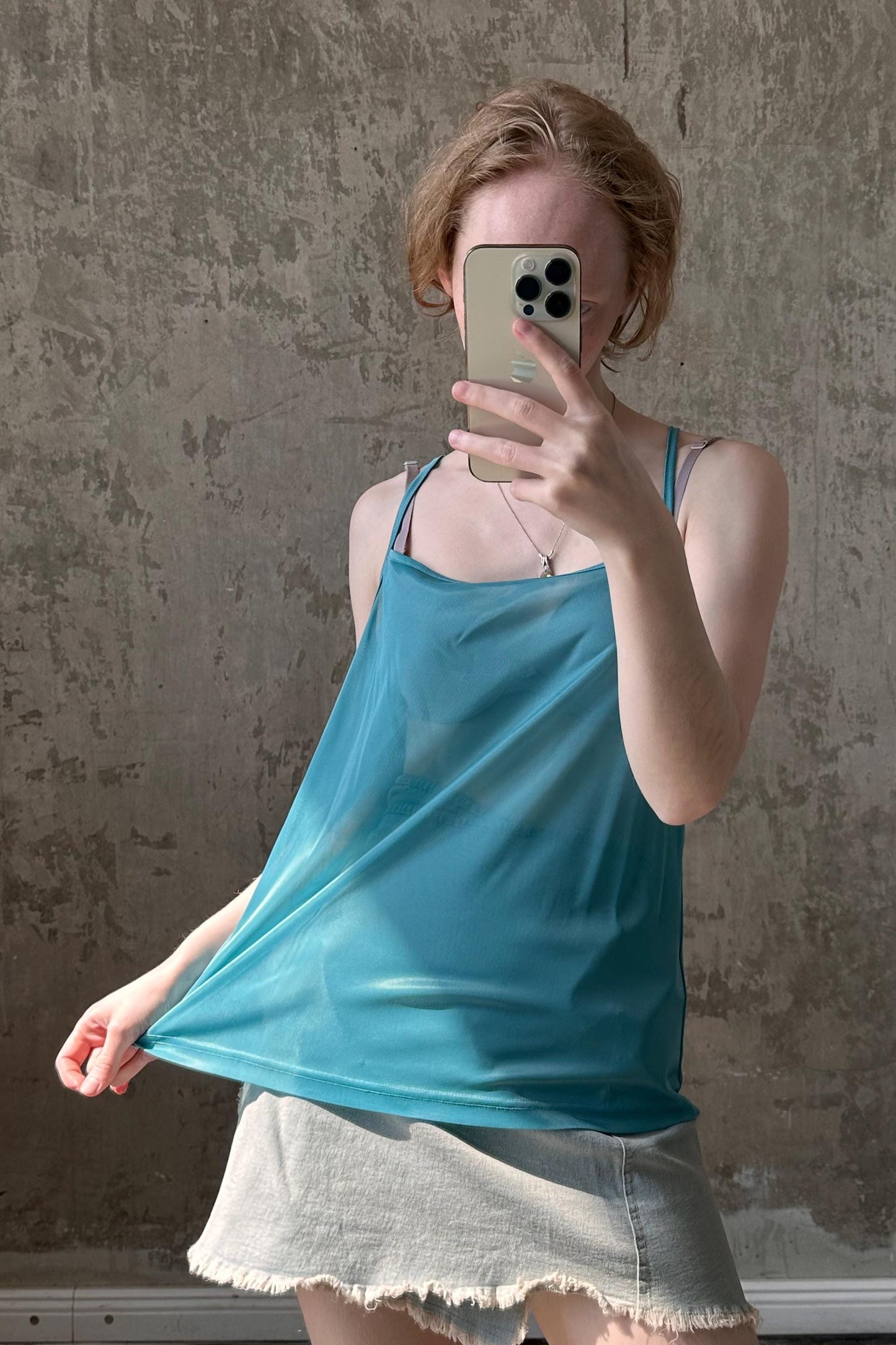 a woman taking a selfie with her cell phone