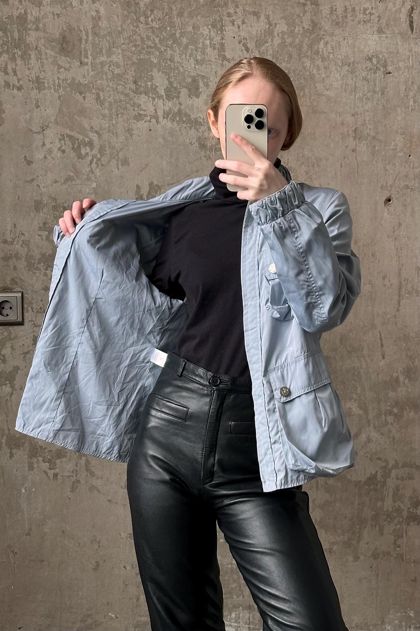 a woman taking a selfie with her cell phone