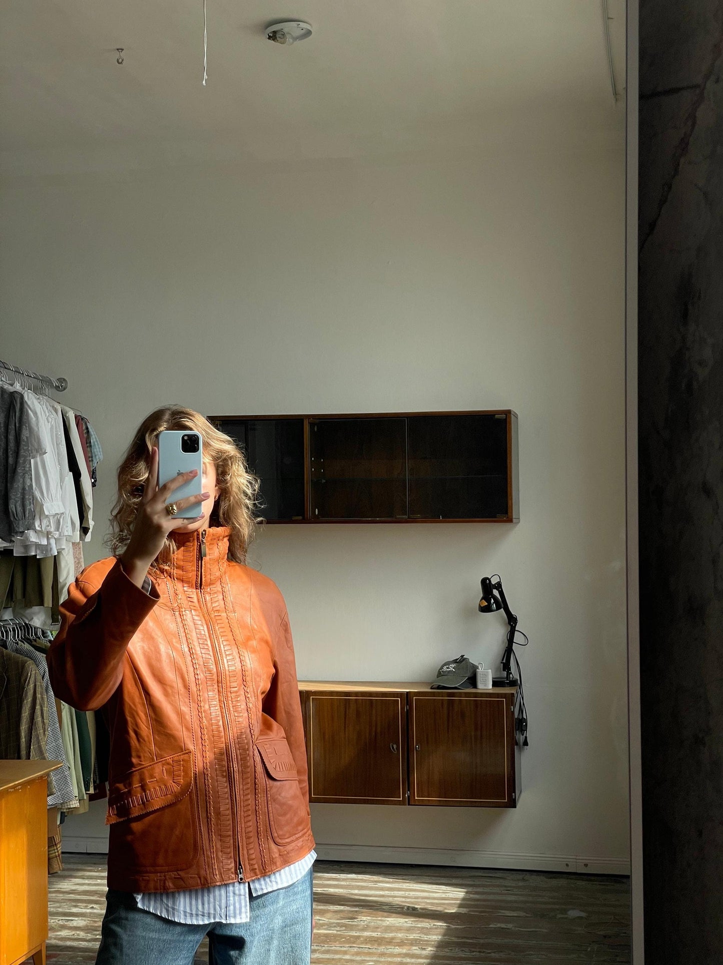 Vintage 90s burnt orange leather jacket with a high collar