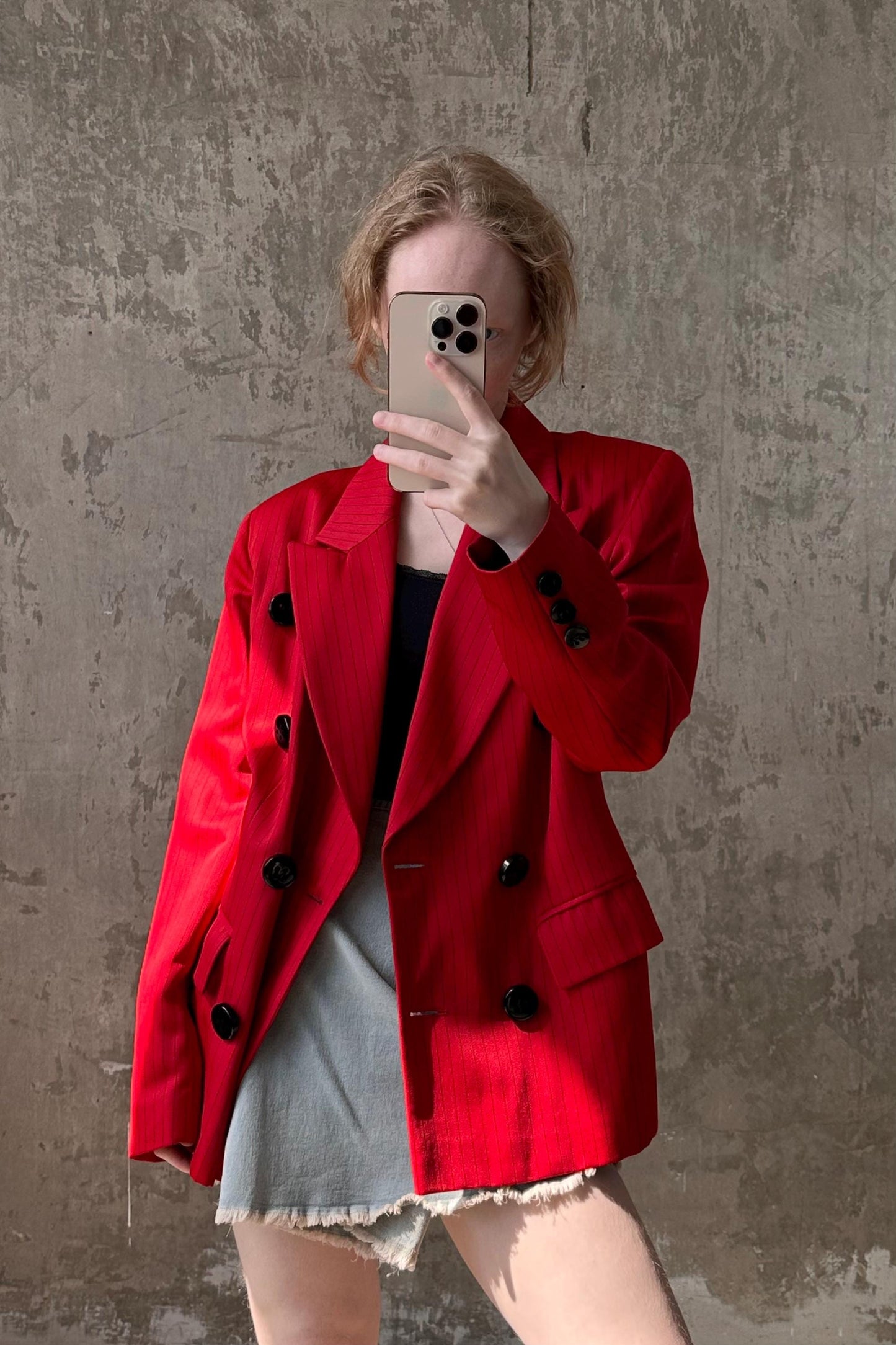 a woman taking a selfie with her cell phone