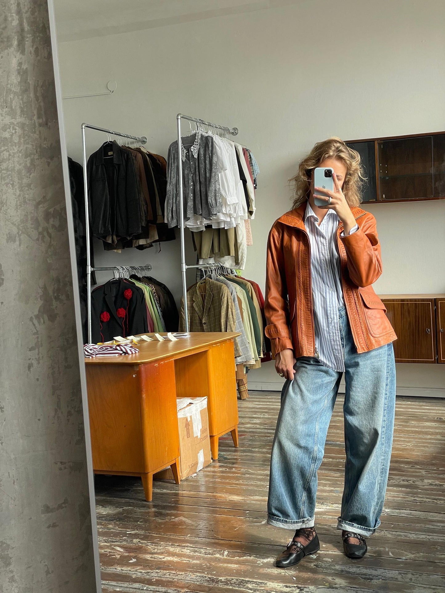 Vintage 90s burnt orange leather jacket with a high collar