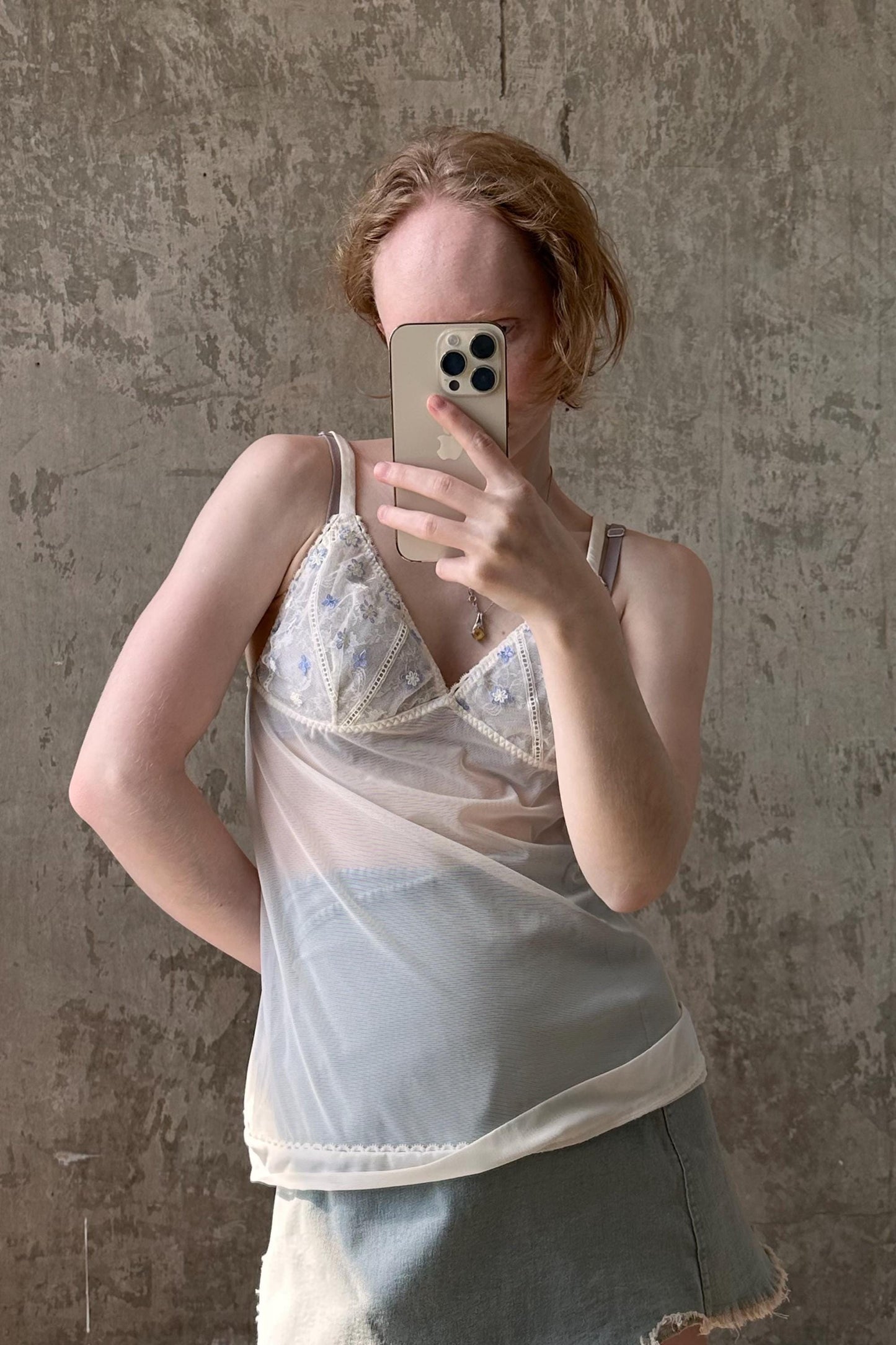 a woman taking a selfie with her cell phone