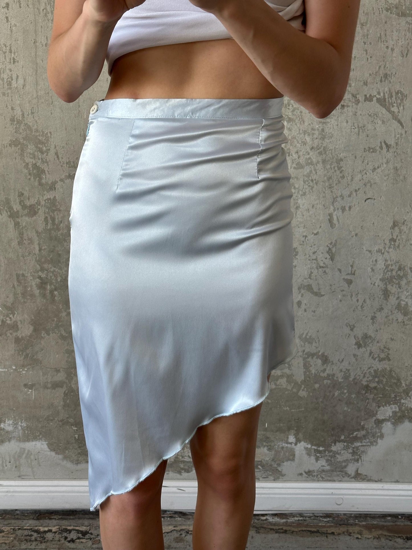 Vintage mini skirt with asymmetrical edge in light blue
