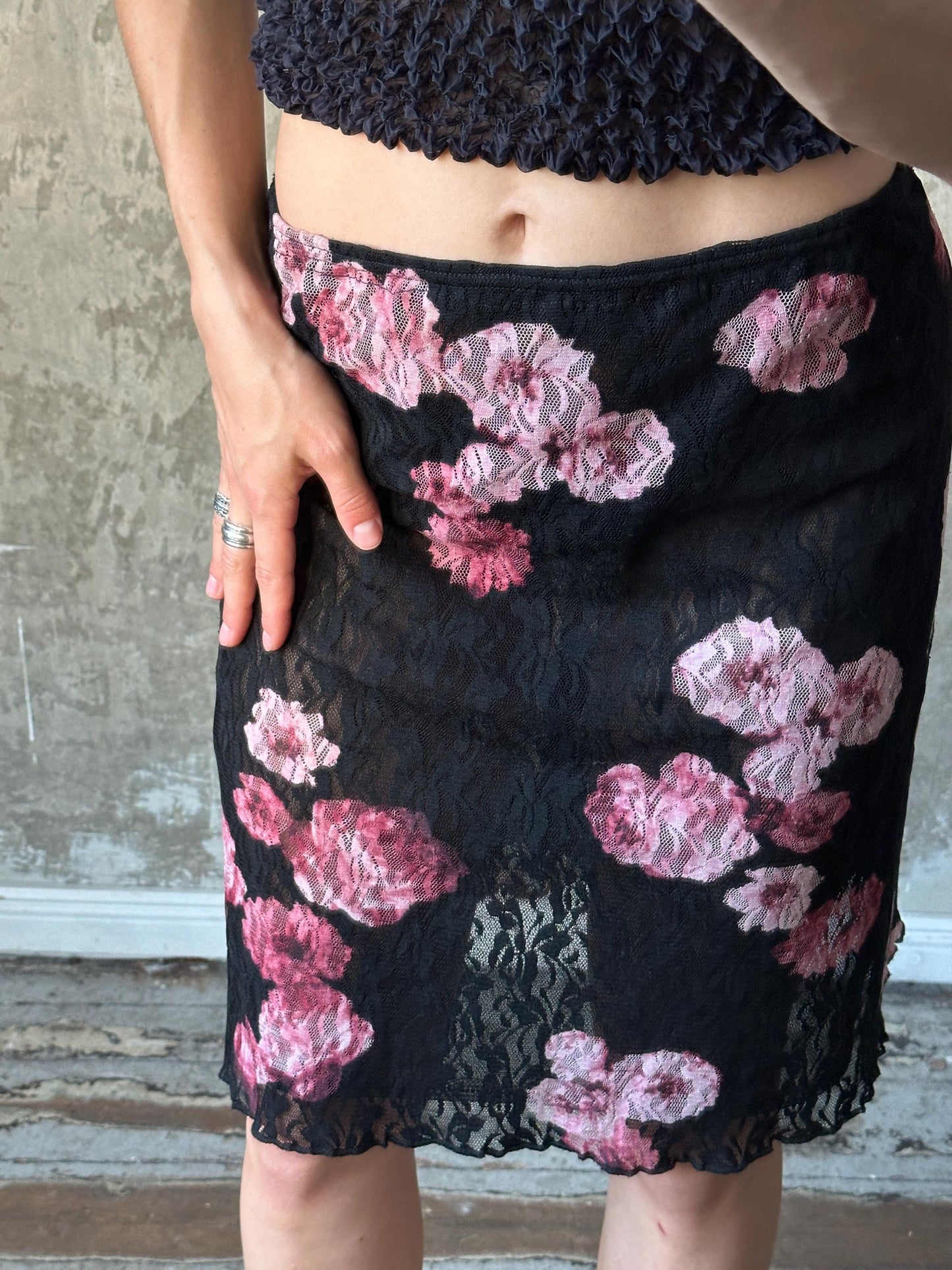 Vintage mini lace skirt with floral motif in black