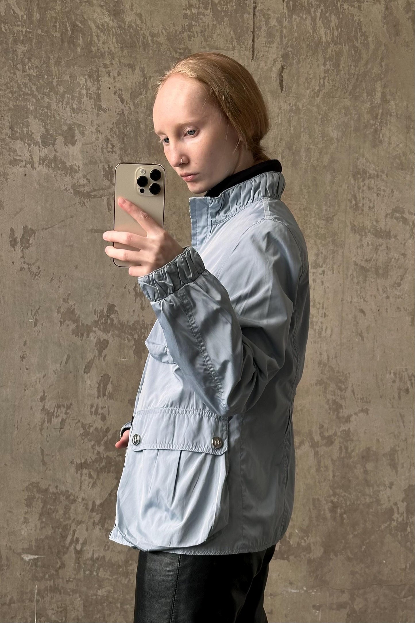a woman taking a selfie with her cell phone