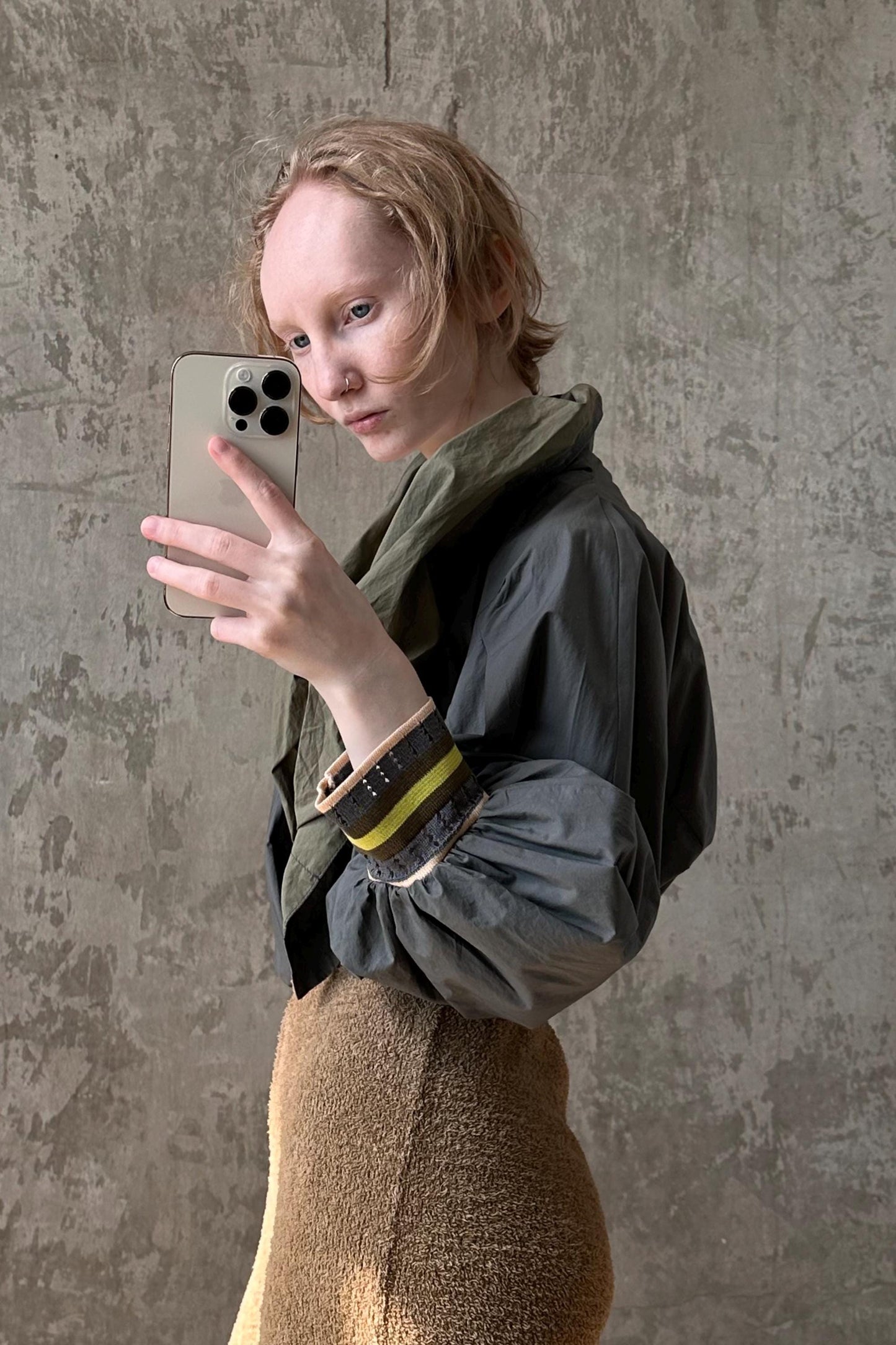 a woman taking a selfie with her cell phone