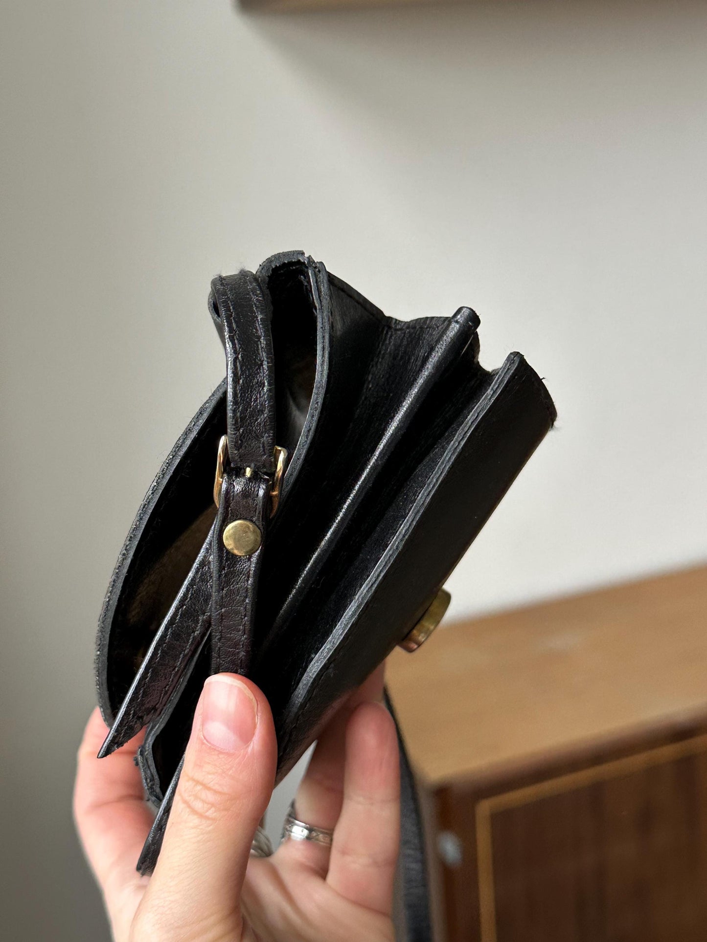 a person holding a wallet in their hand