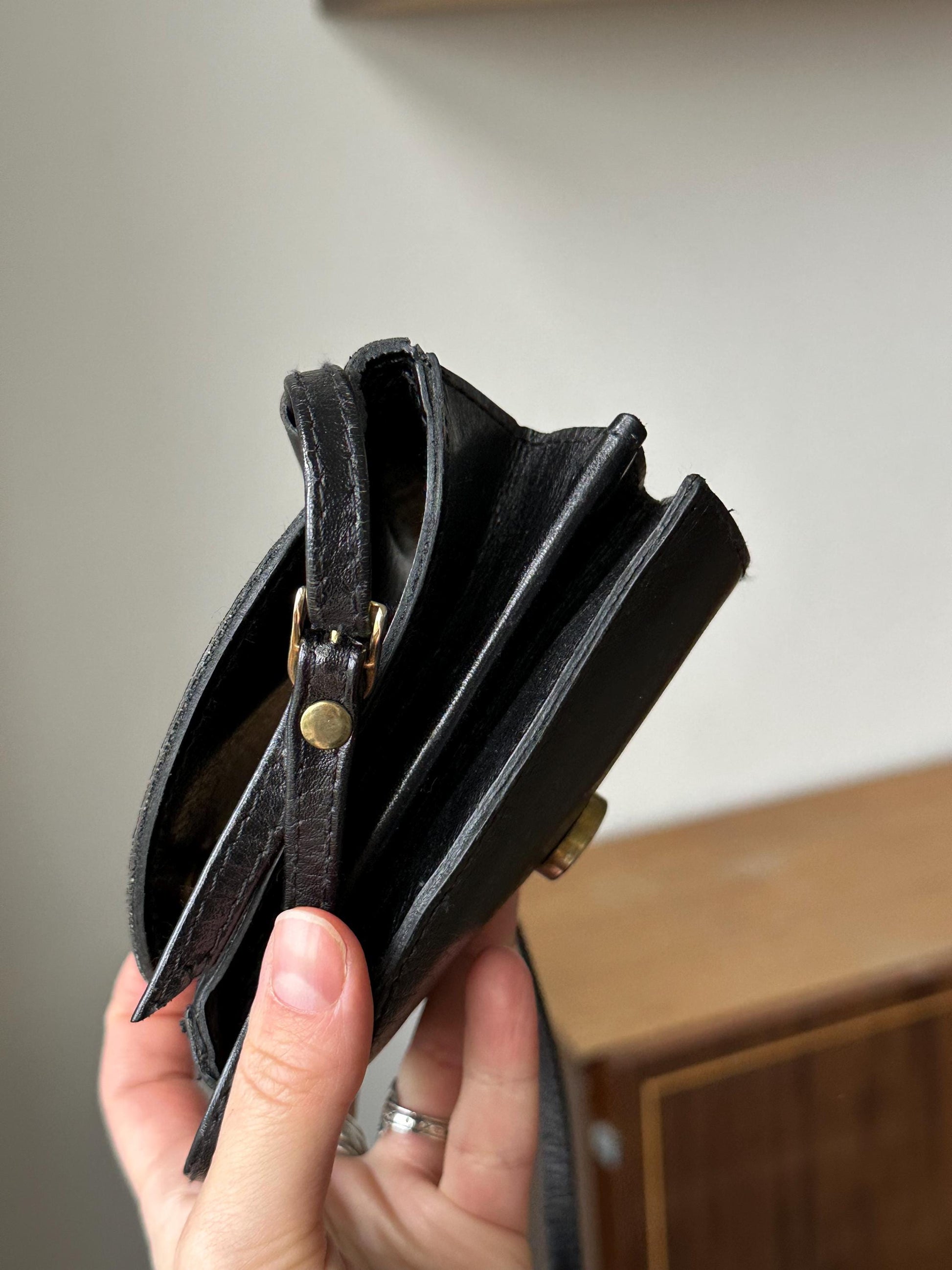a person holding a wallet in their hand