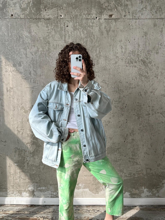 a woman taking a selfie with her cell phone