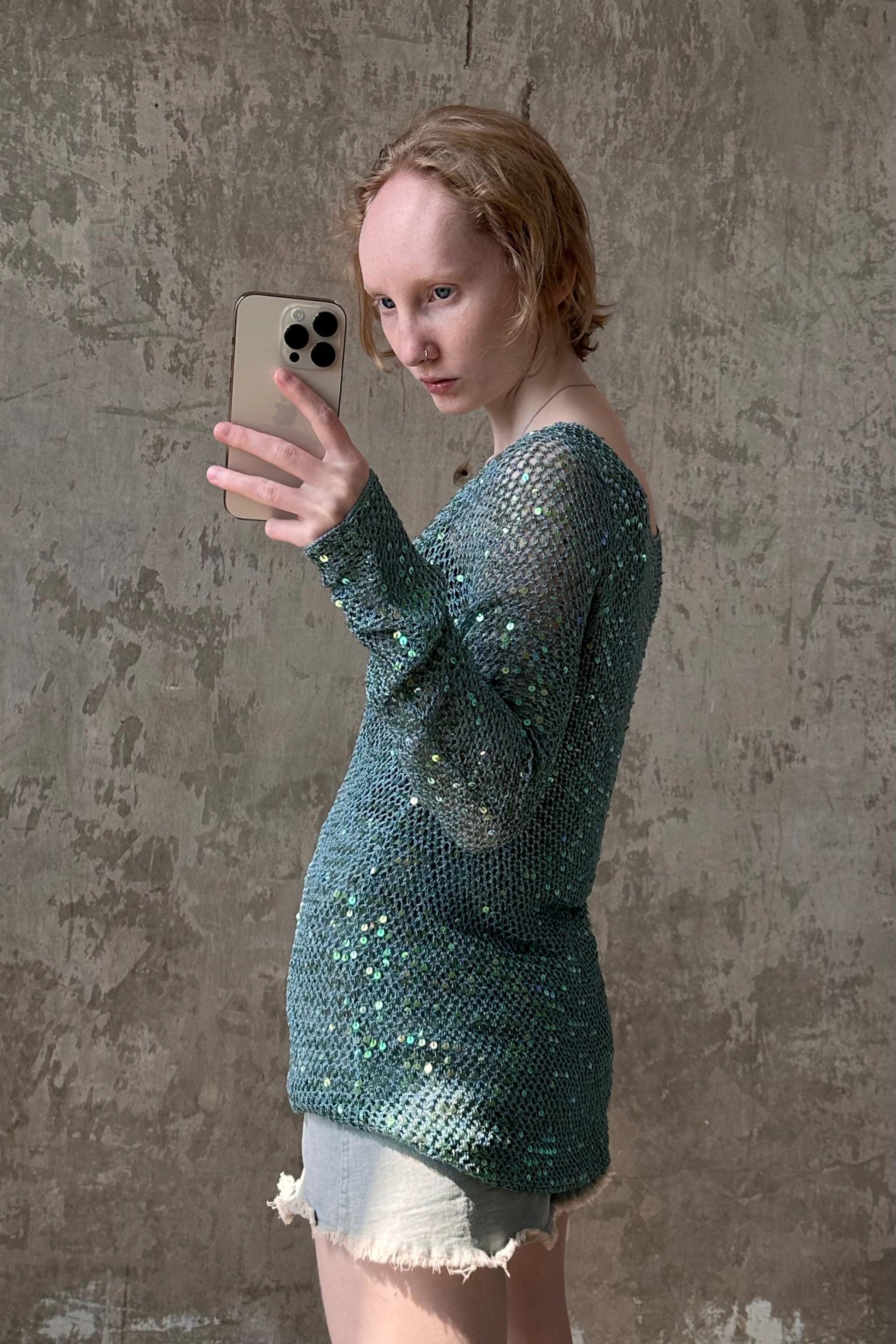 a woman is taking a selfie with her cell phone