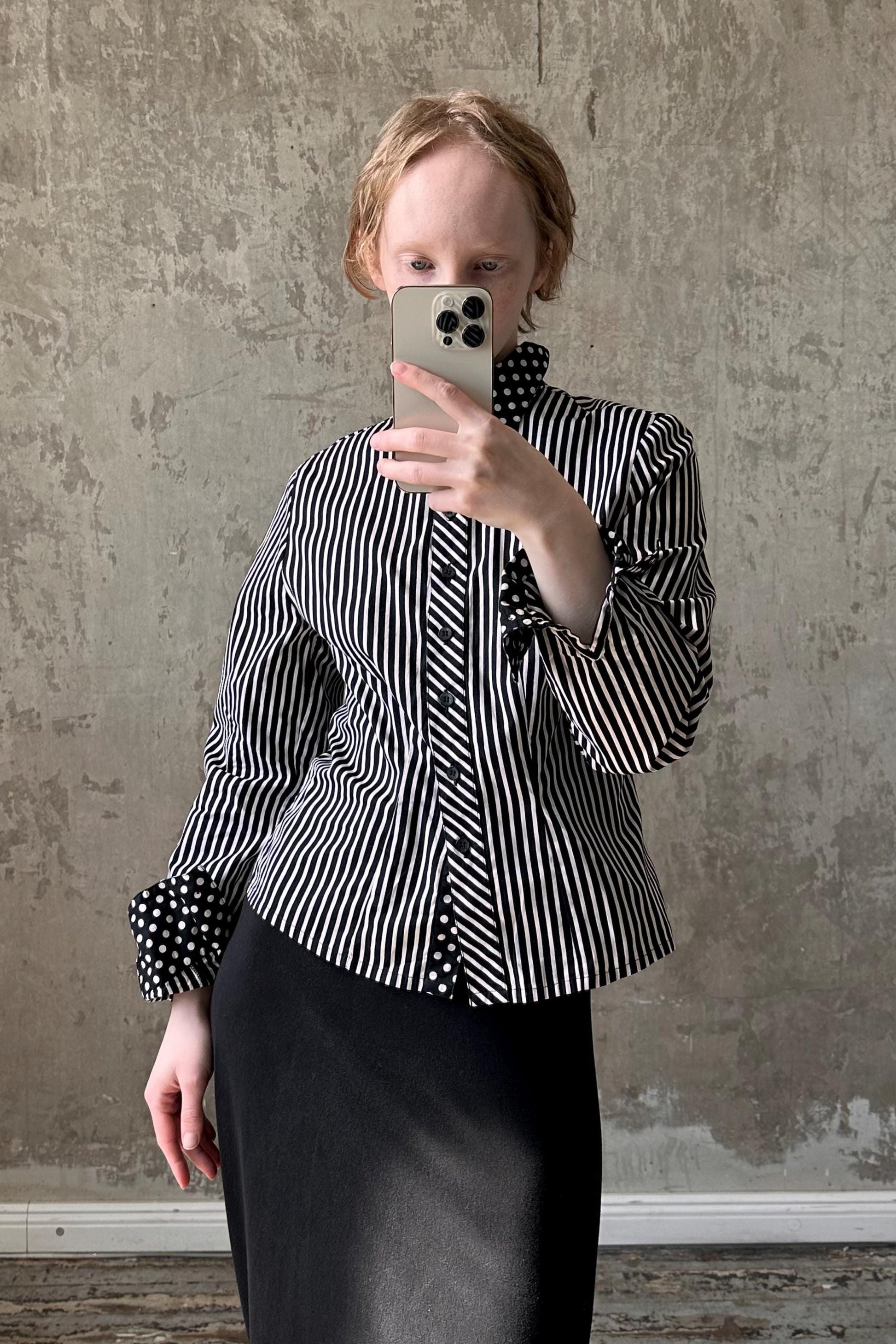 a woman taking a selfie with her cell phone