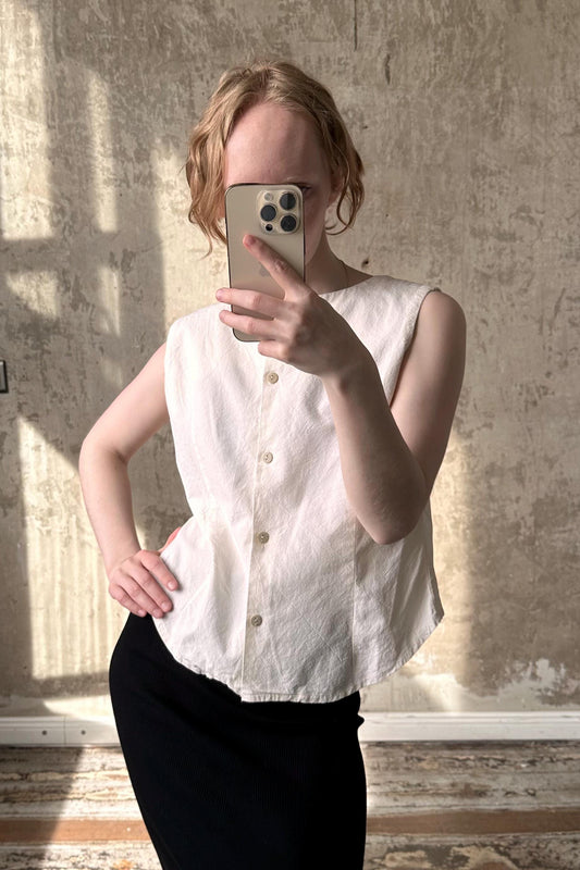 a woman taking a selfie with her cell phone