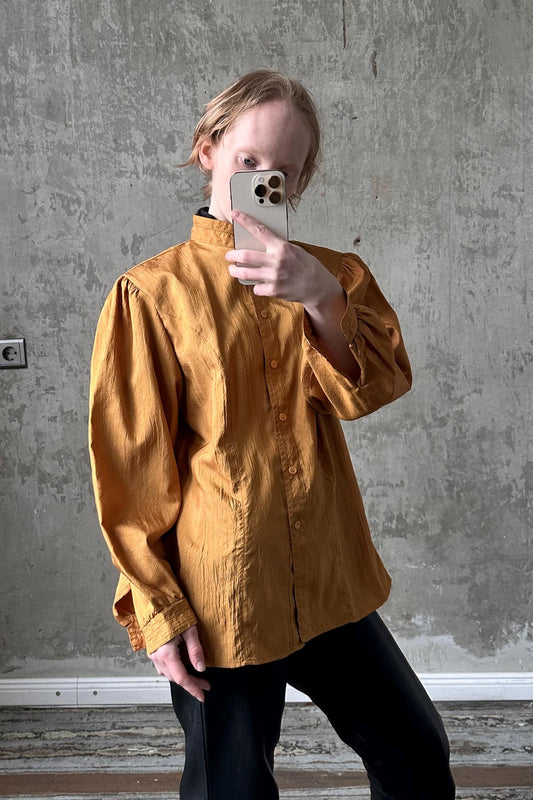 a woman taking a selfie with her cell phone