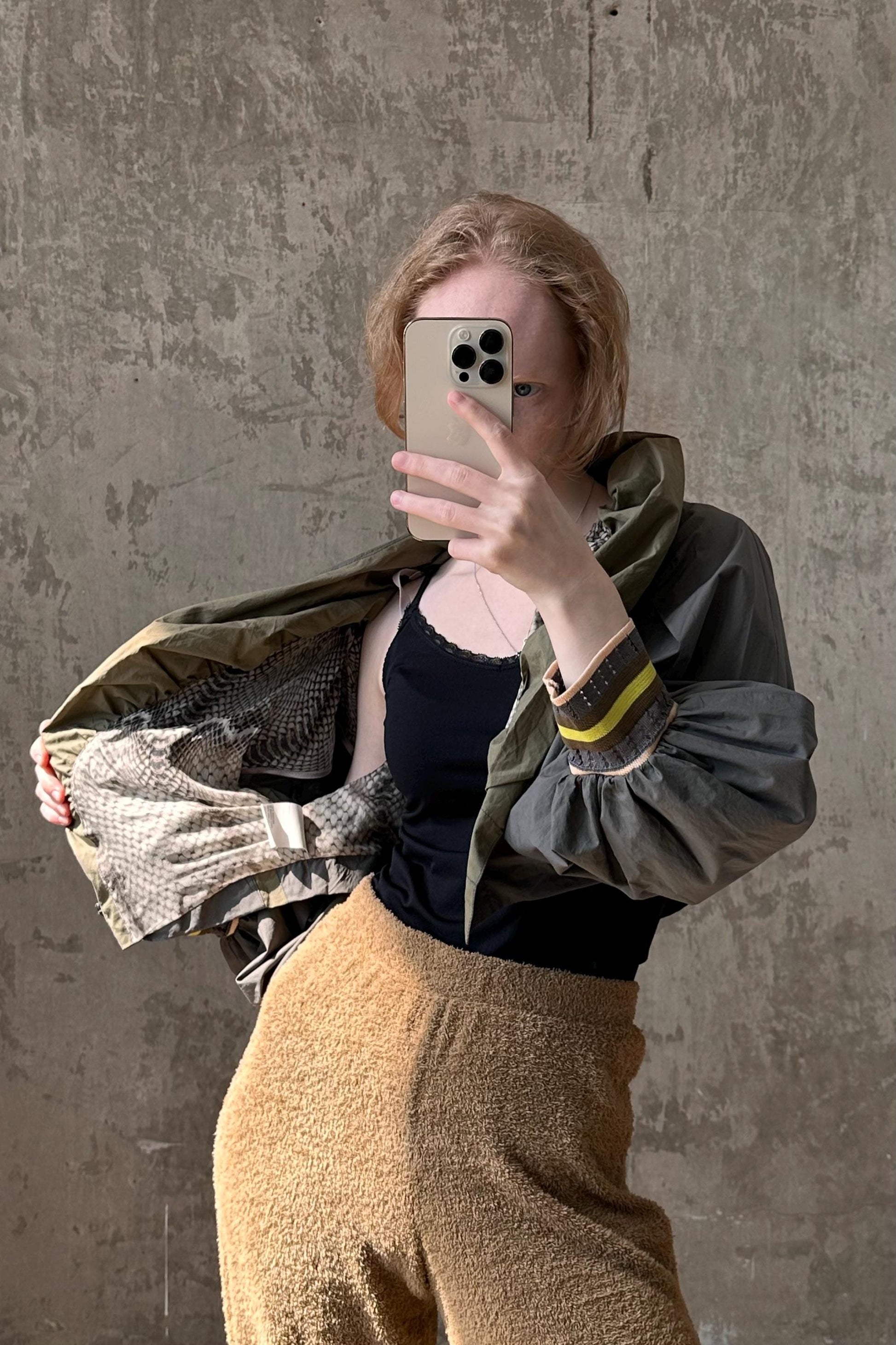 a woman taking a selfie with her cell phone