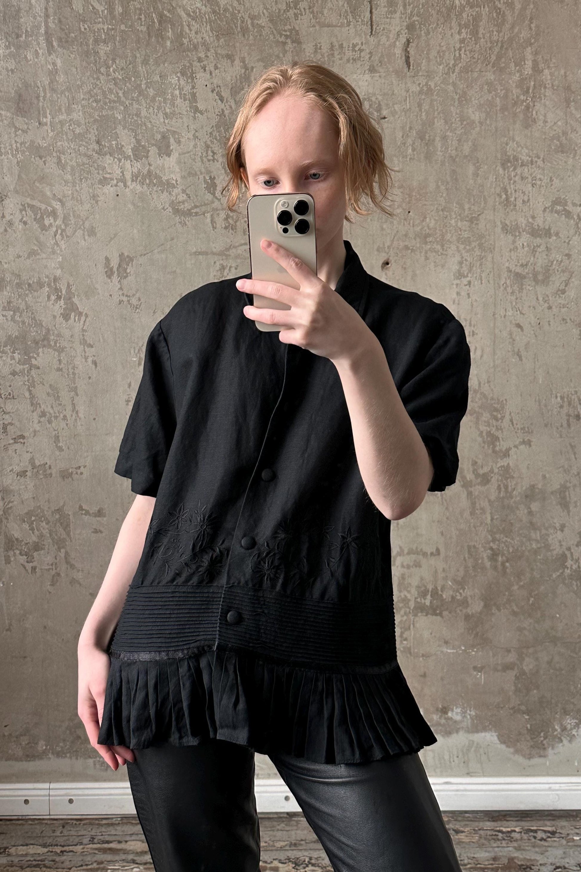 a woman taking a selfie with her cell phone