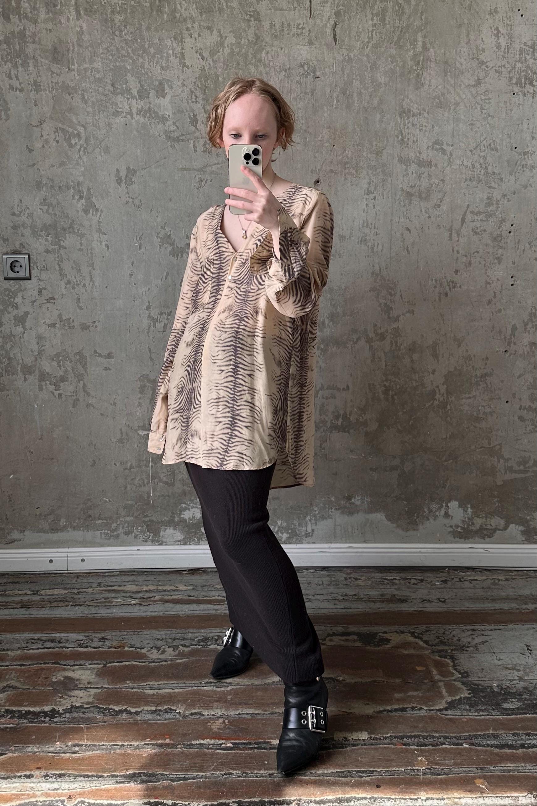 a woman taking a selfie with her cell phone