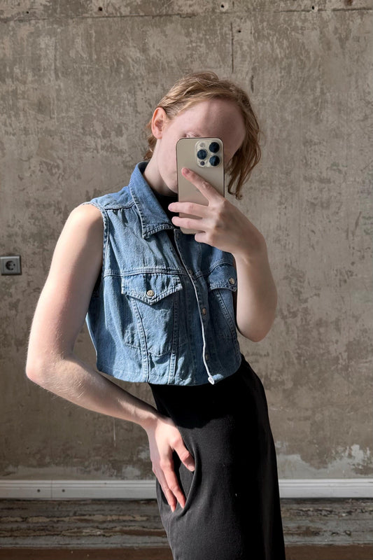 a woman taking a selfie with her cell phone