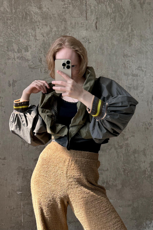 a woman taking a selfie with her cell phone