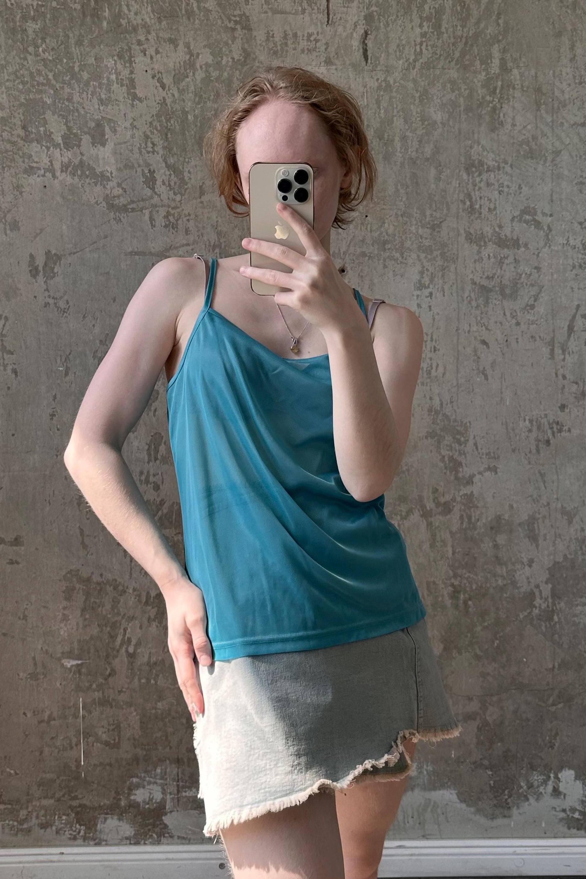 a woman taking a selfie with her cell phone
