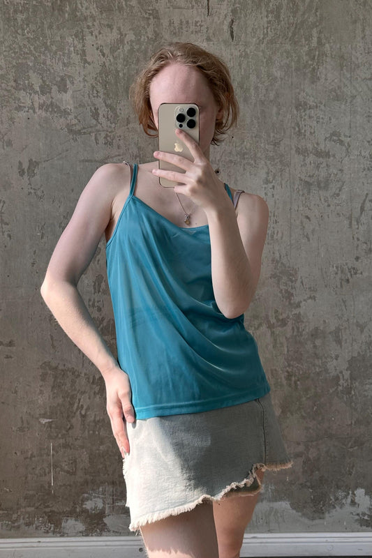 a woman taking a selfie with her cell phone