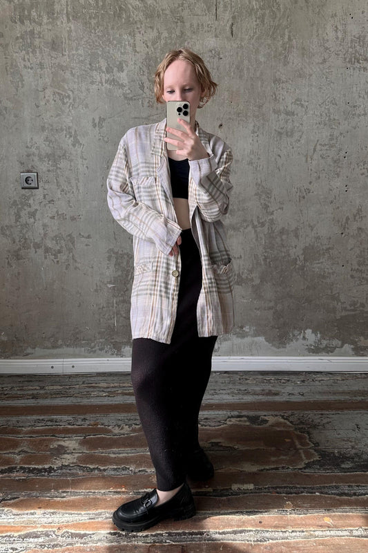 a woman taking a selfie with her cell phone
