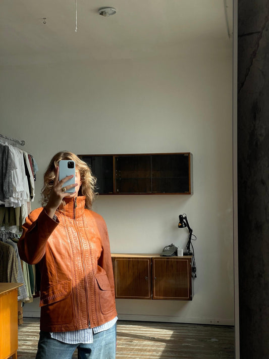 Vintage 90s burnt orange leather jacket with a high collar