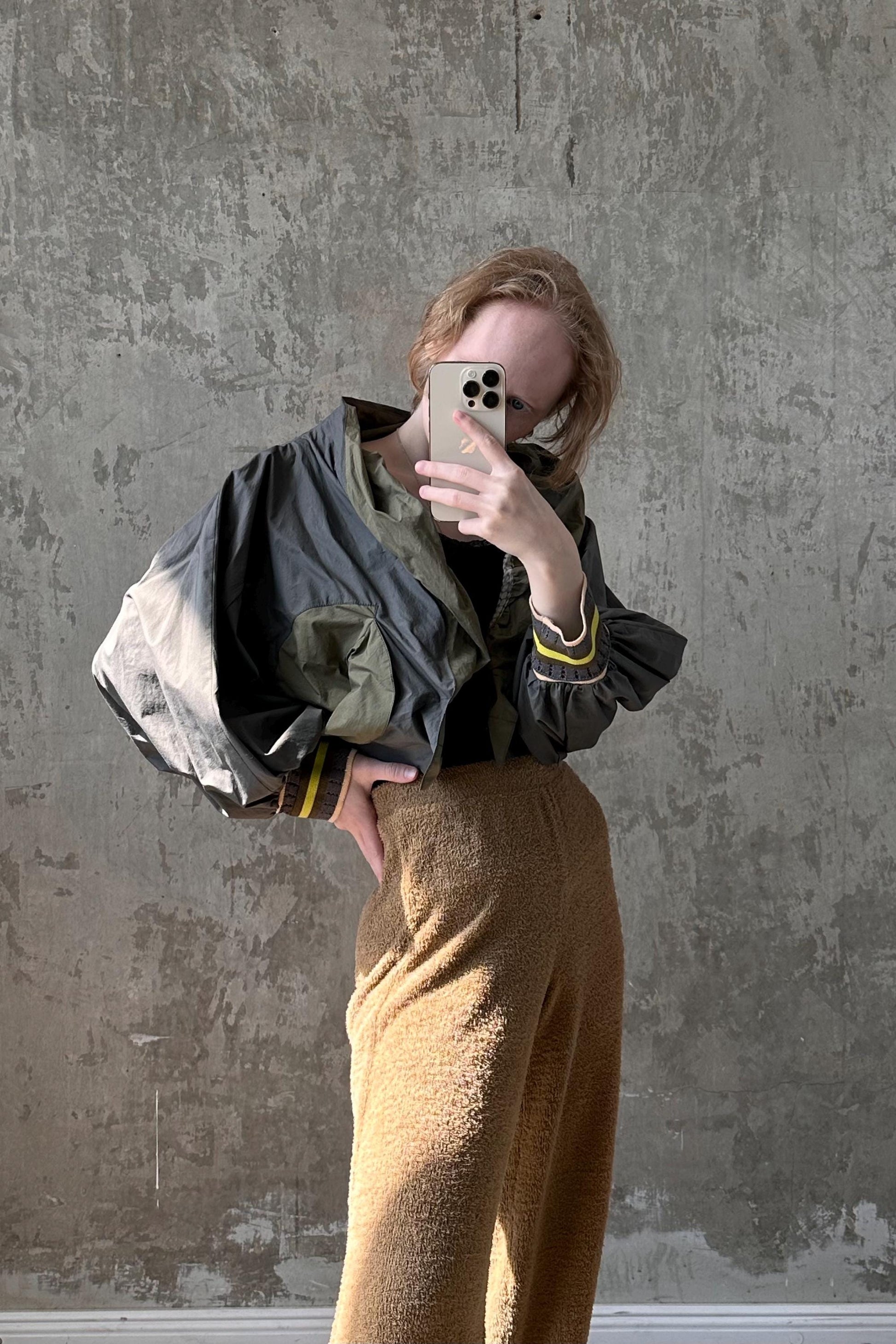 a woman taking a selfie with her cell phone