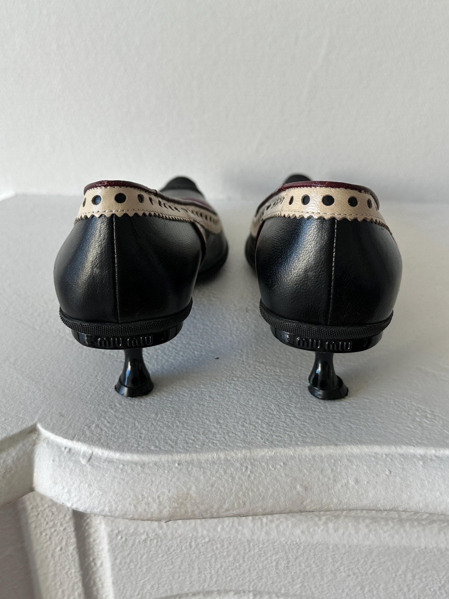 Miu Miu Black & Cream Perforated Leather Kitten Heel Pumps I US 6.5