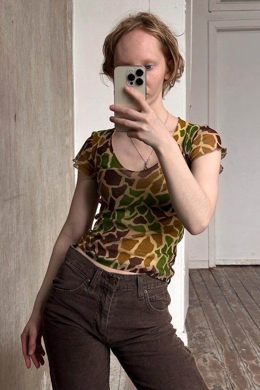a woman taking a selfie with her cell phone