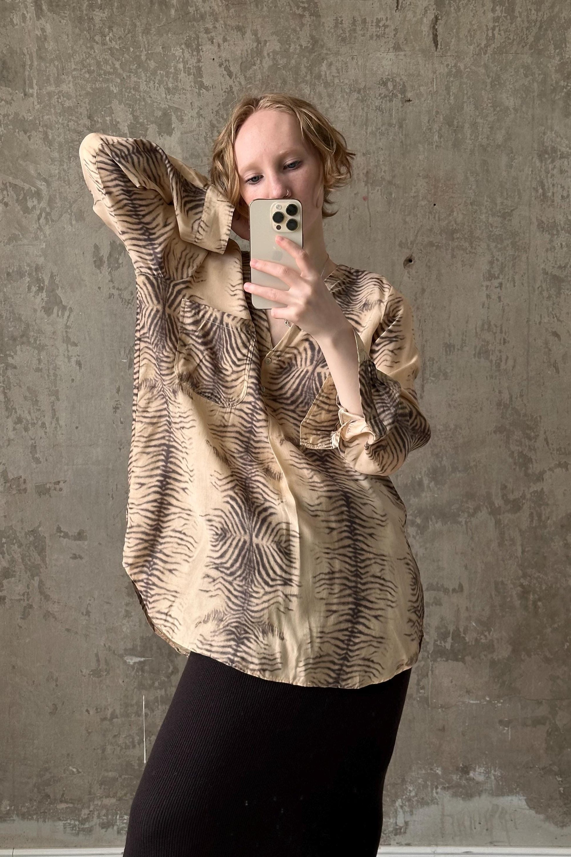 a woman taking a selfie with her cell phone