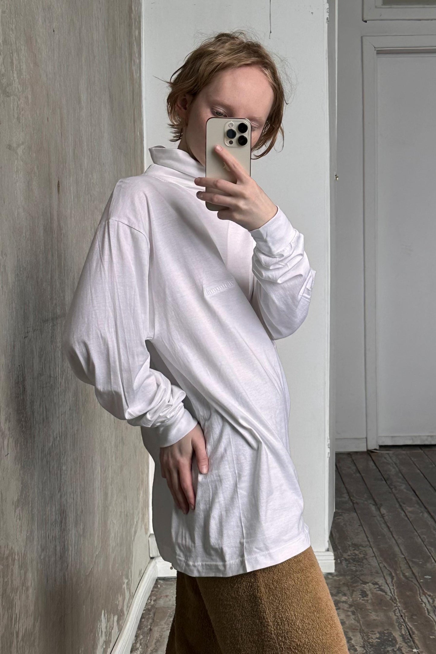 a woman taking a selfie with her cell phone