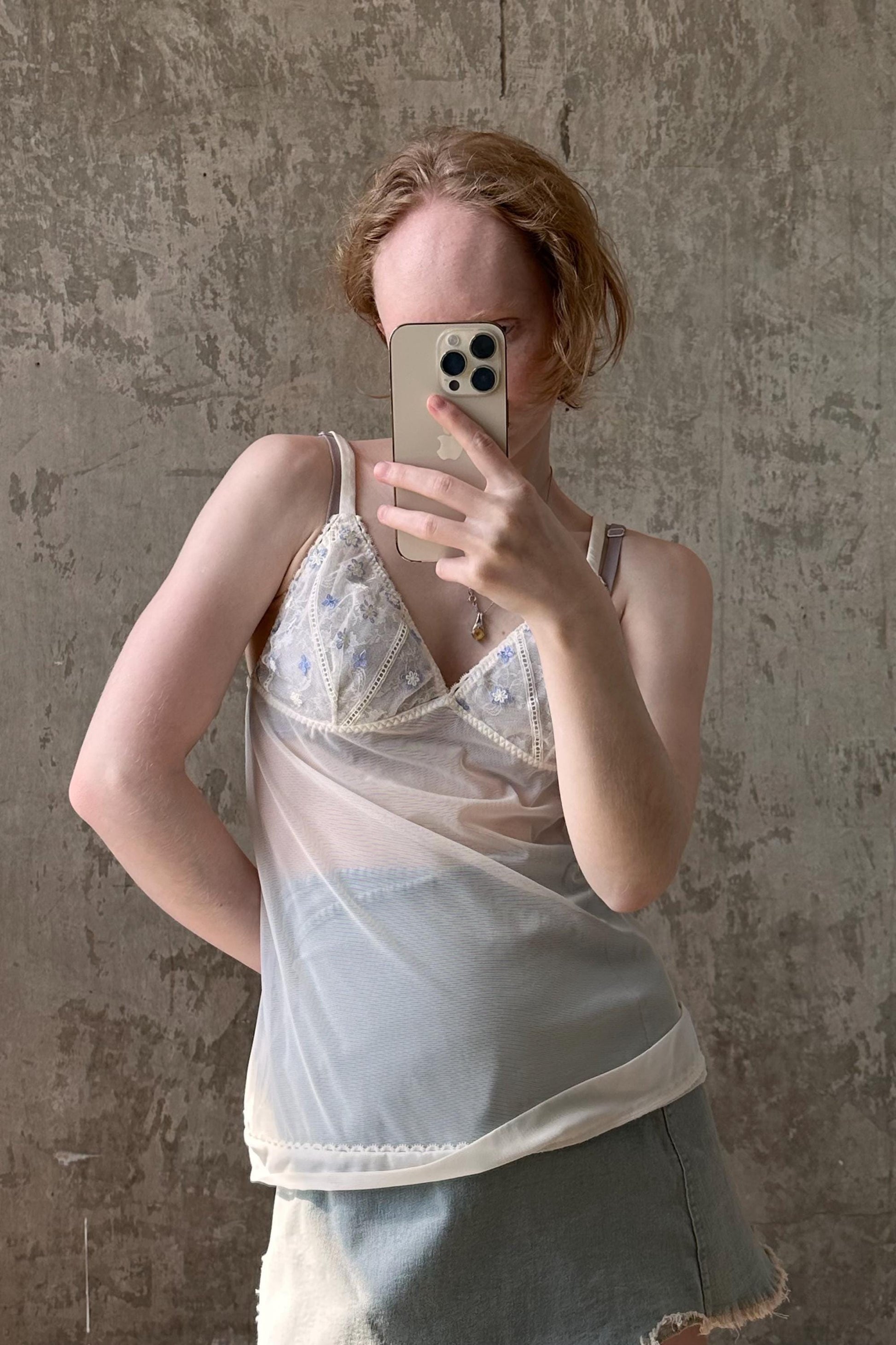 a woman taking a selfie with her cell phone