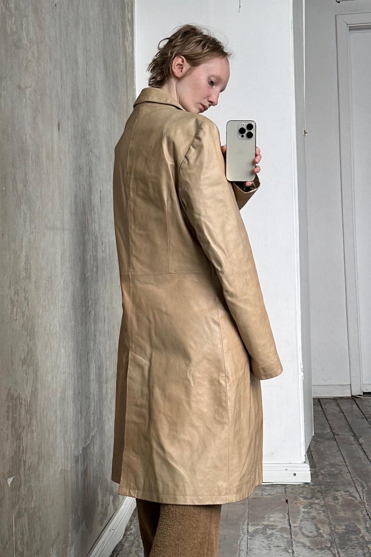 a woman is taking a picture of herself in a mirror