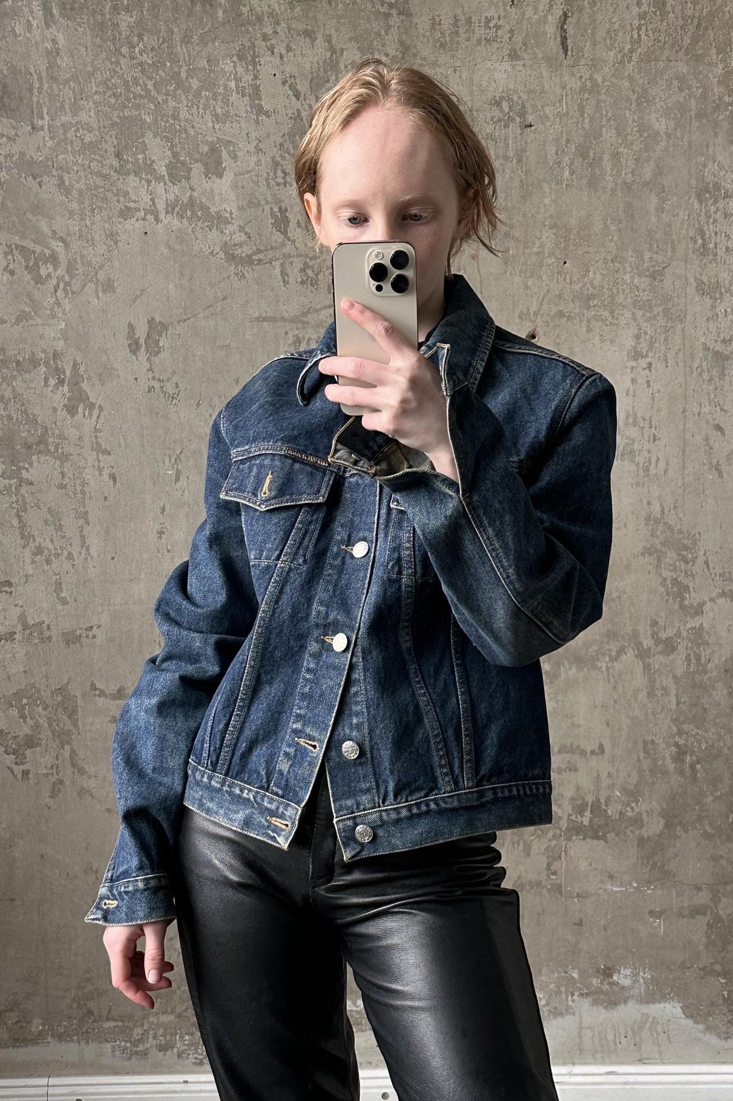 a woman taking a selfie with her cell phone