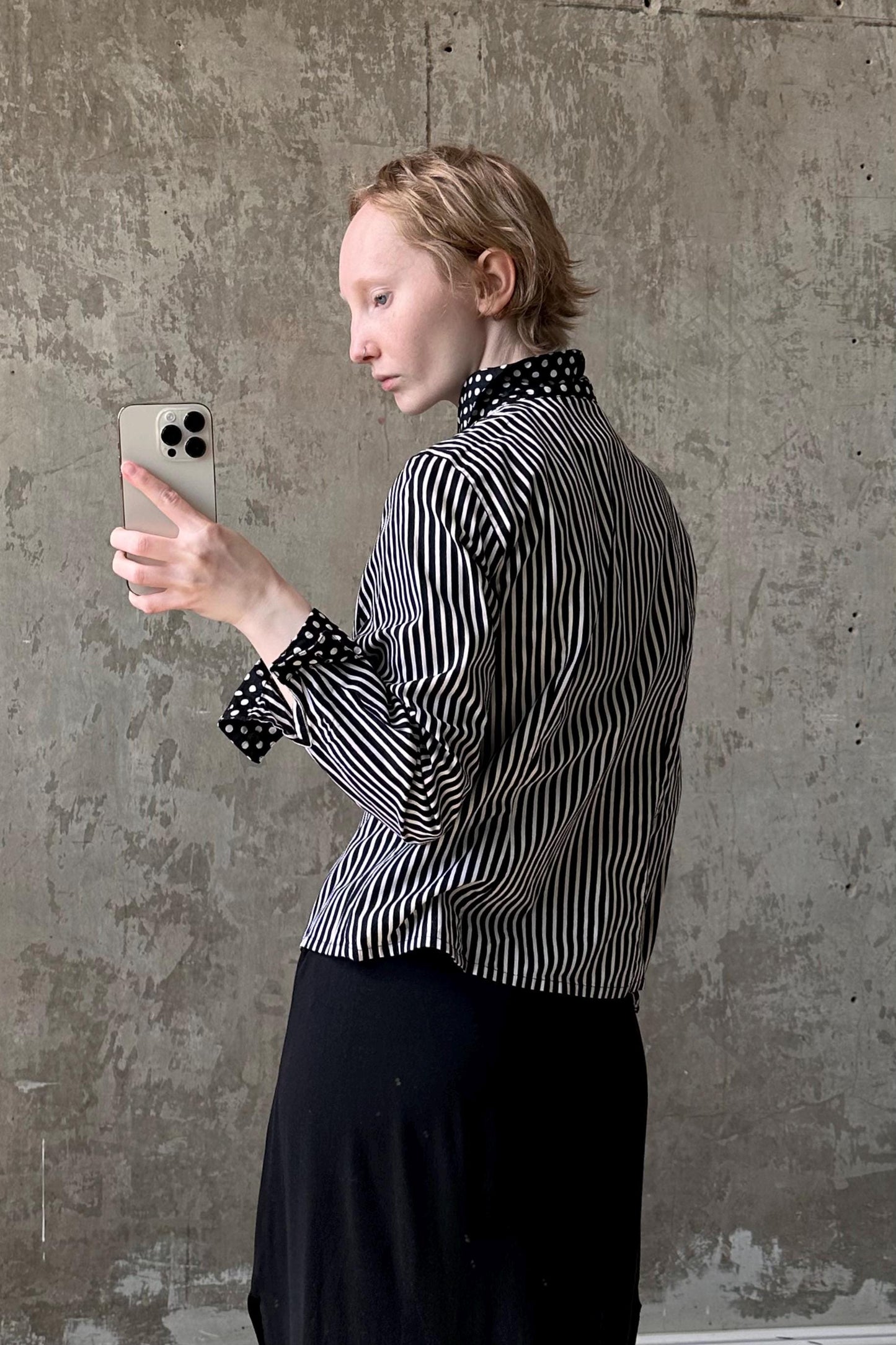 a woman is taking a picture with her cell phone