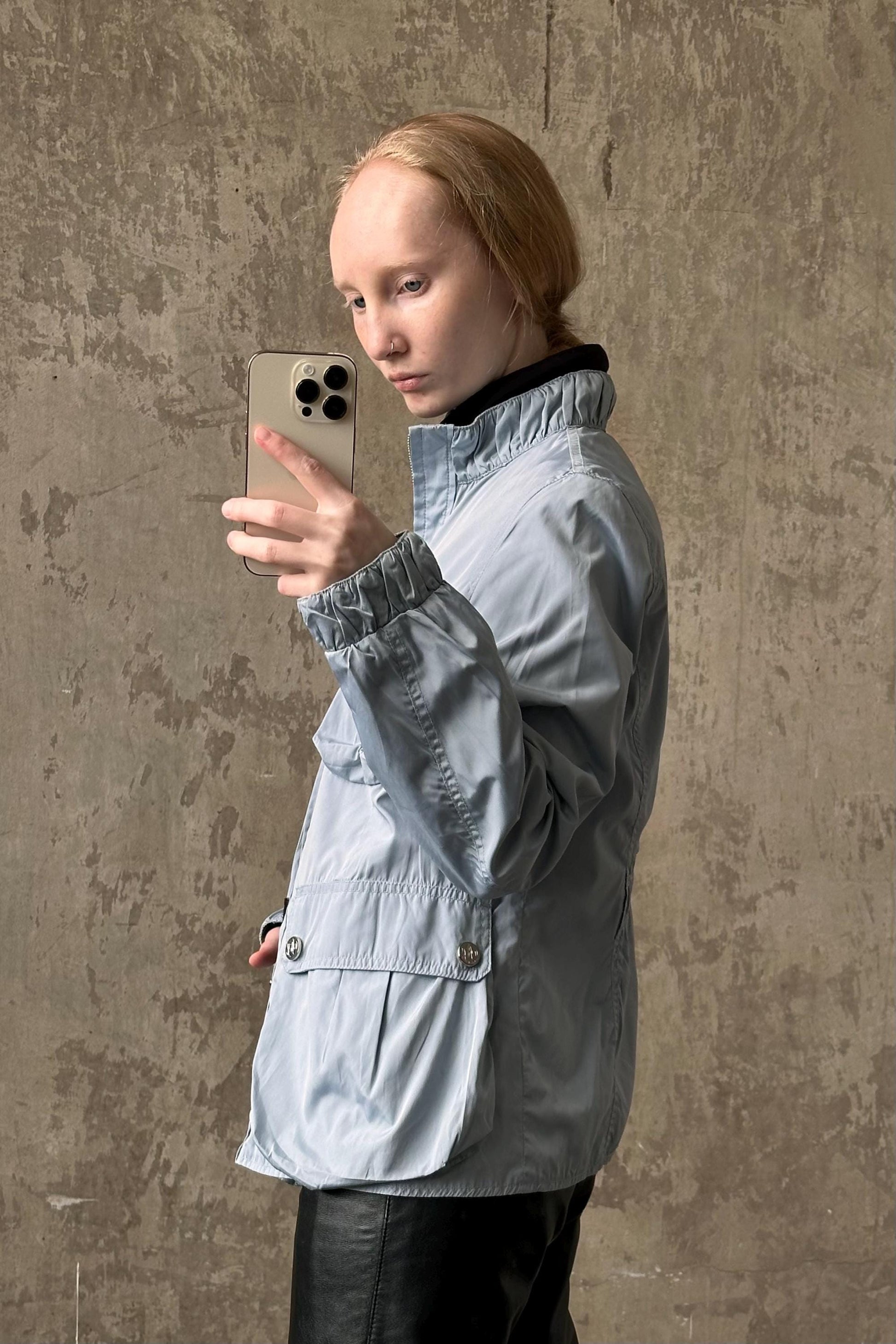 a woman taking a selfie with her cell phone