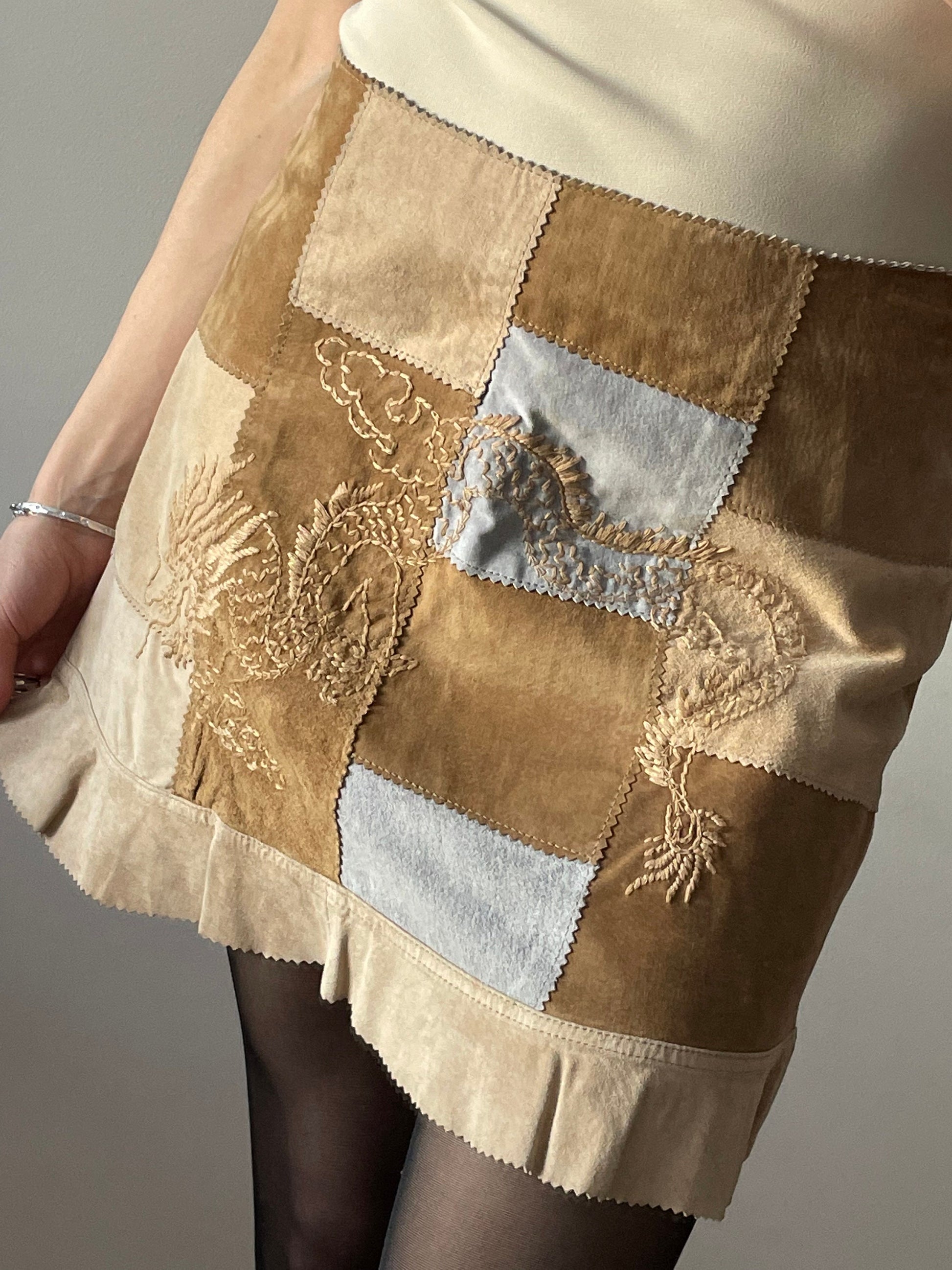Vintage leather mini skirt with dragoon embroidery, low rise skirt in beige, patchwork suede leather skirt