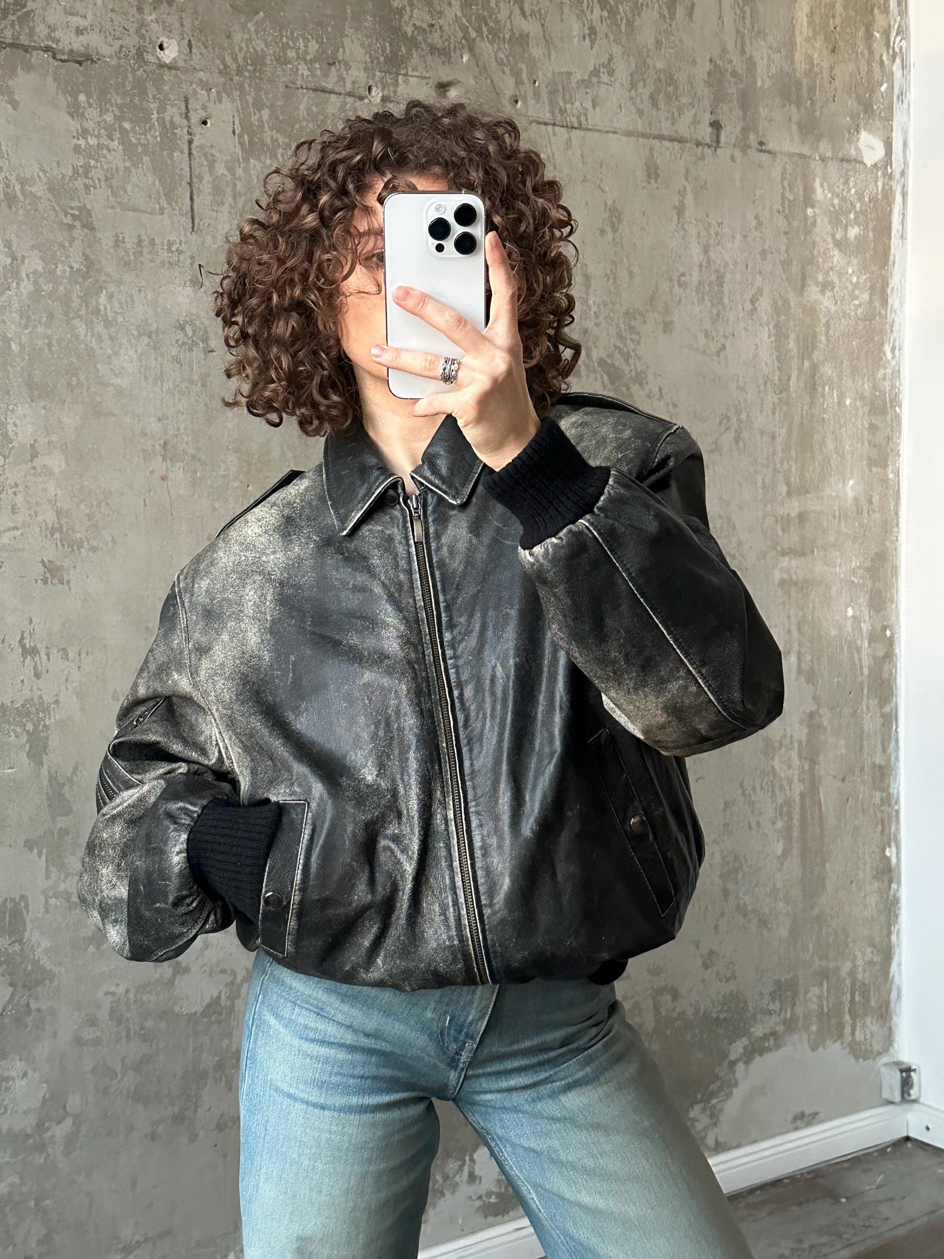 Vintage distressed leather bomber jacket in black with shades