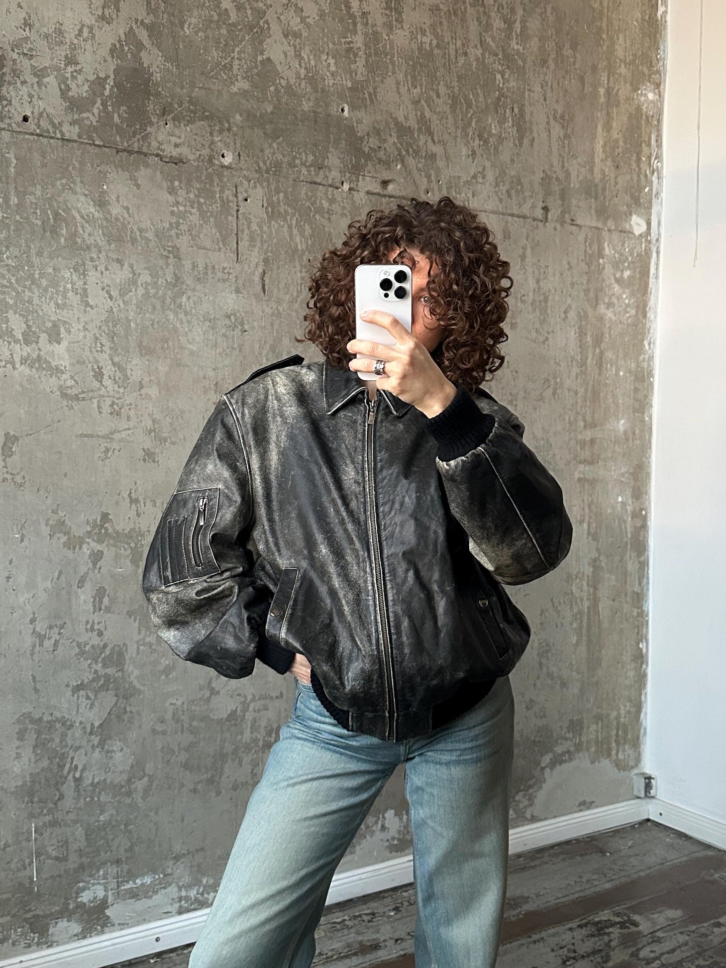 Vintage distressed leather bomber jacket in black with shades